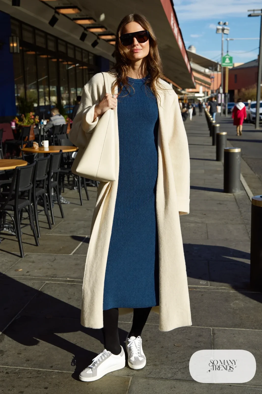 Woman in an indigo ribbed knit midi dress, cream cardigan and white sneakers on a Las Vegas brunch stroll, outfit 28