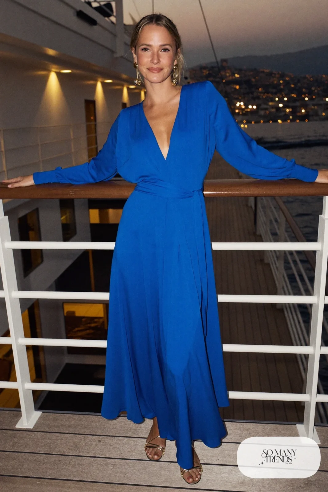 Cobalt blue wrap gown with gold belt and gold sandals, formal night cruise look 4