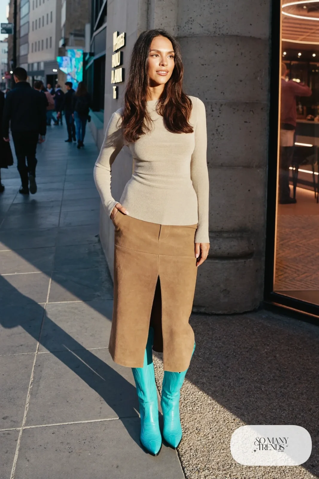 Woman in camel knit top, camel midi skirt and turquoise cowboy boots, outfit 27