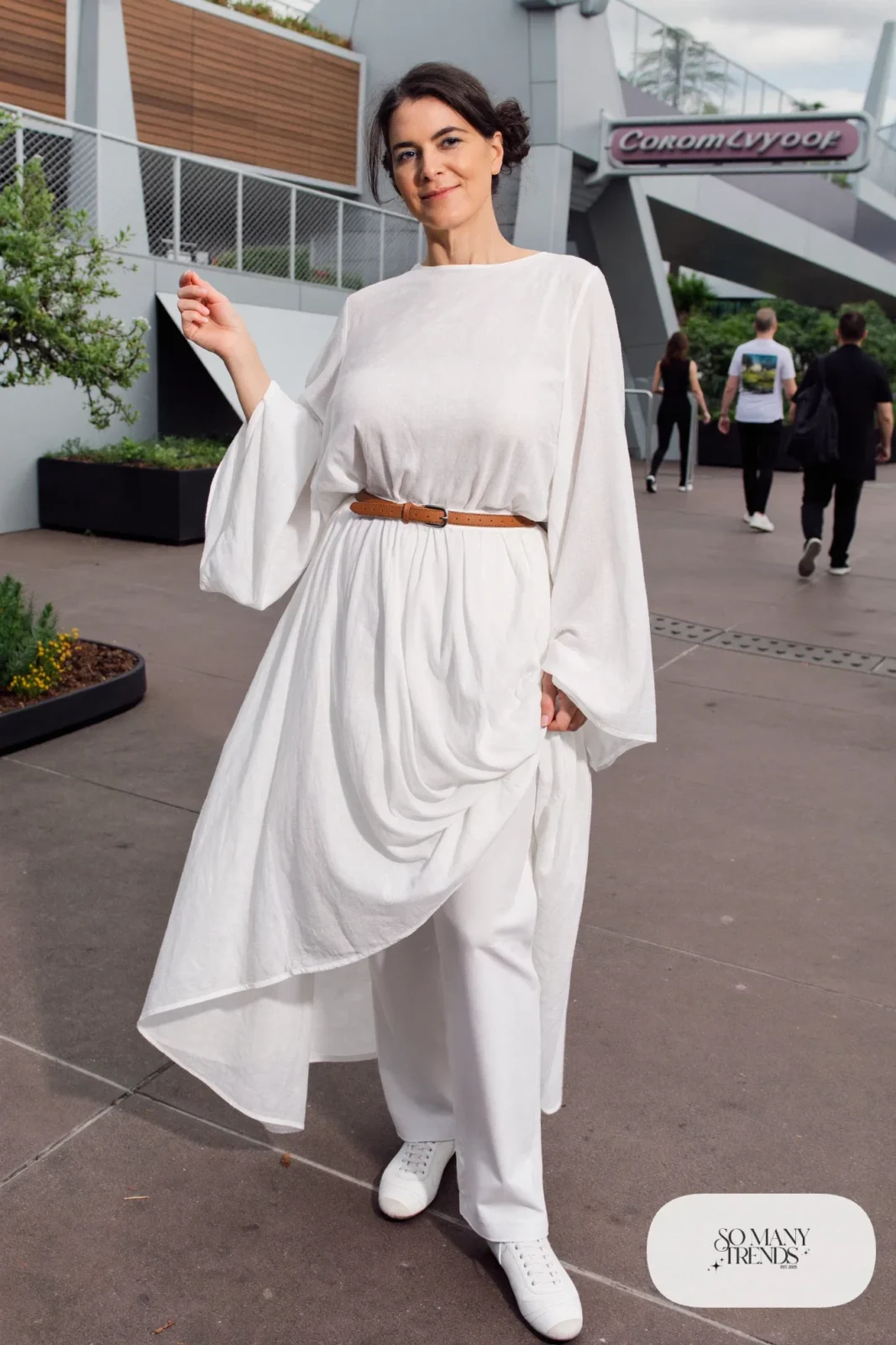 White flowing top, white straight pants, caramel belt and white sneakers, outfit 17