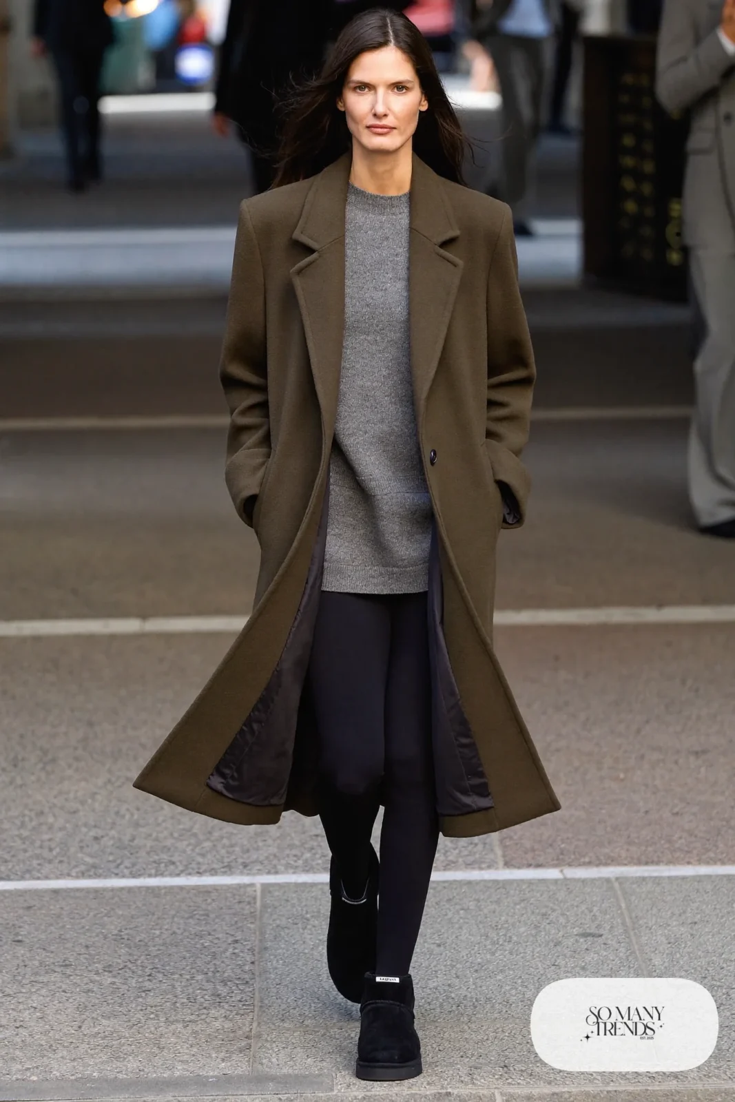 Woman in black leggings, gray knit, long olive wool parka and black Ugg mini boots, outfit 6