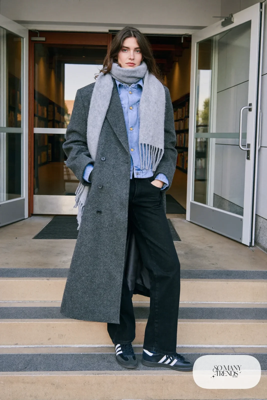 Woman in gray wool coat over denim jacket, black jeans, gray scarf and black Adidas Campus sneakers, outfit 20