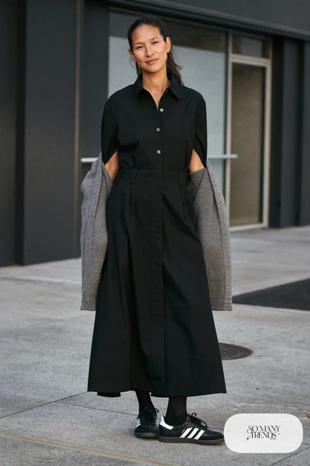 Woman in black shirt dress, long gray cardigan, black tights and black Adidas Campus sneakers, outfit 23