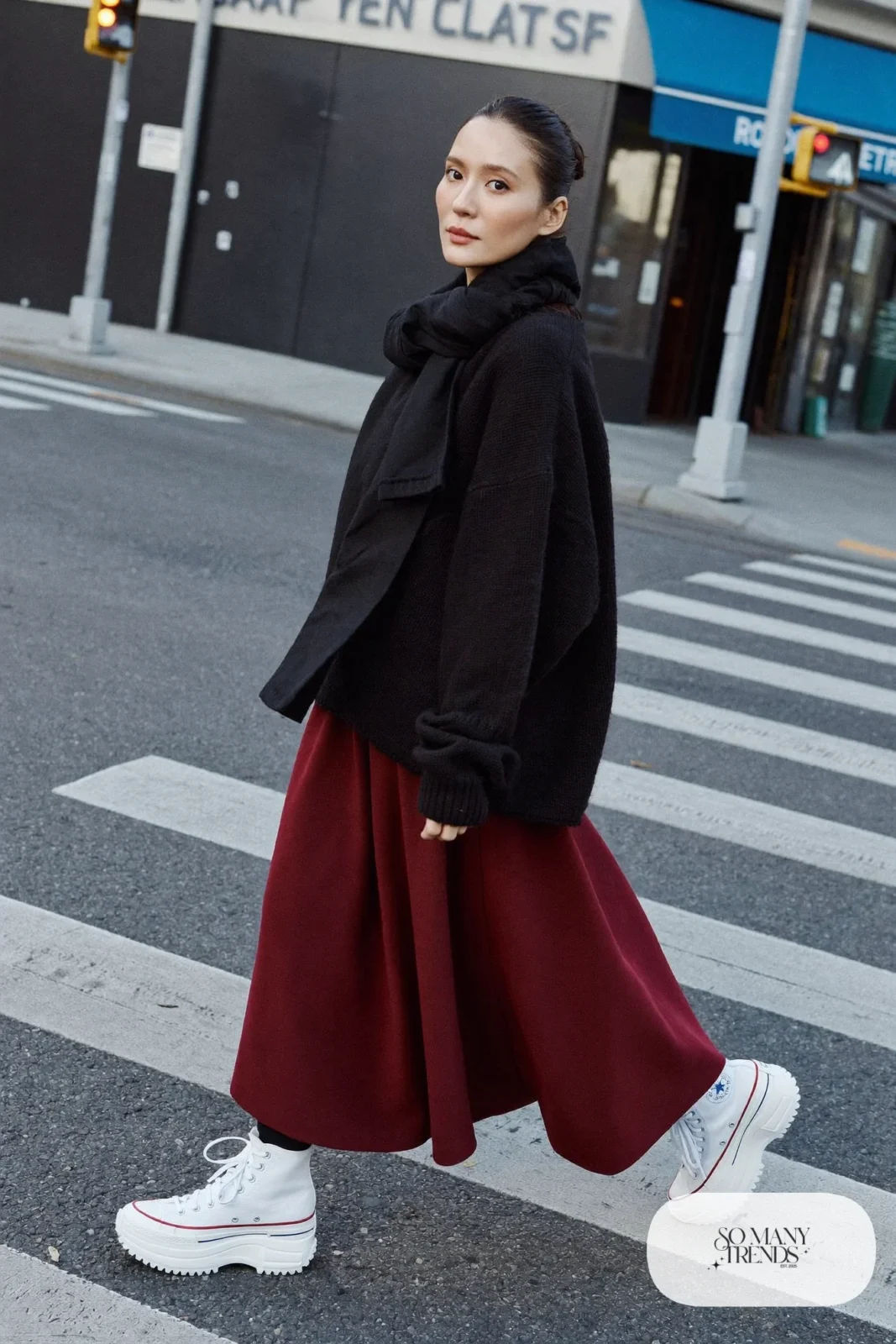 Woman in a burgundy midi skirt, black chunky knit sweater, black opaque tights and white Converse Run Star Hike platform sneakers - outfit 4