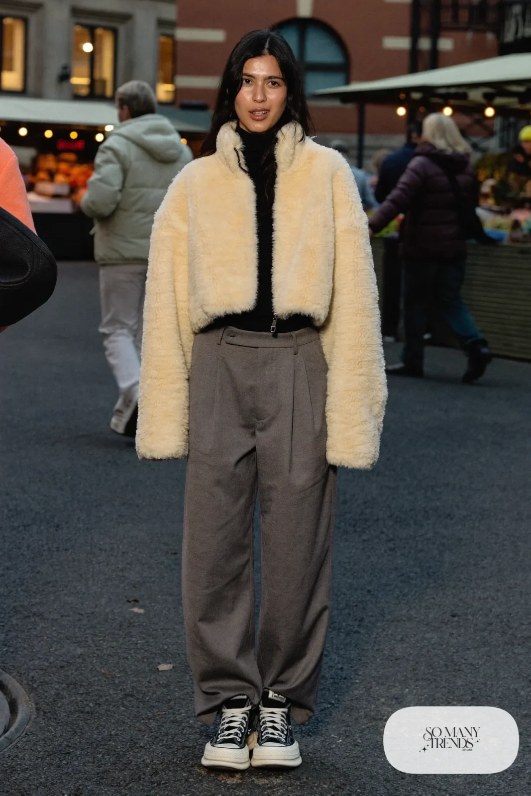 Woman in a cropped shearling jacket, black turtleneck, wide gray pants and black Converse Run Star Hike platform sneakers - outfit 20