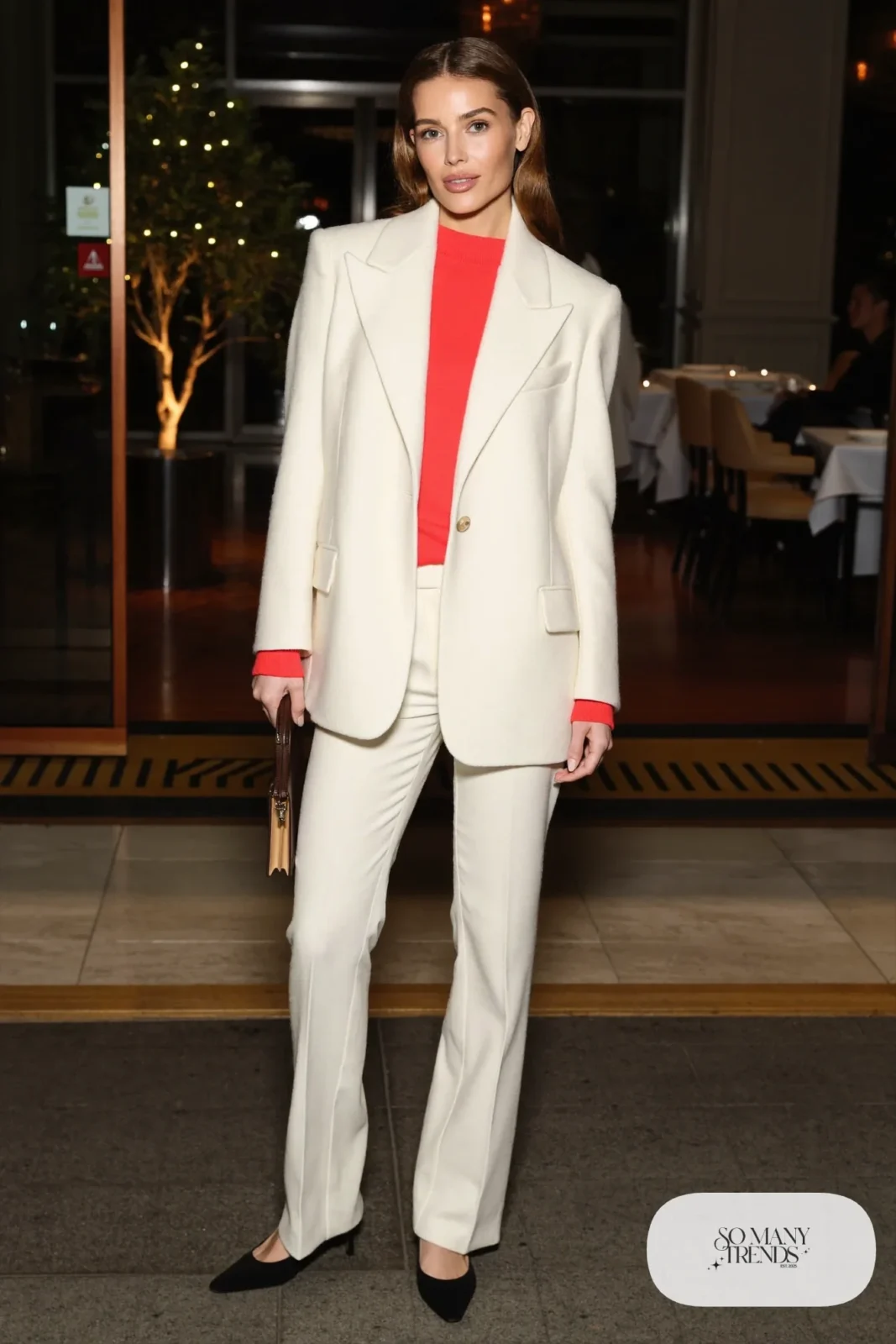 Ivory wool suit with fitted red knit shell and black pumps, outfit 14