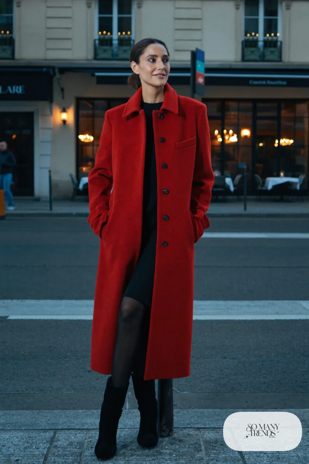 Woman in a long red wool coat over a black knit dress and black boots, look 26