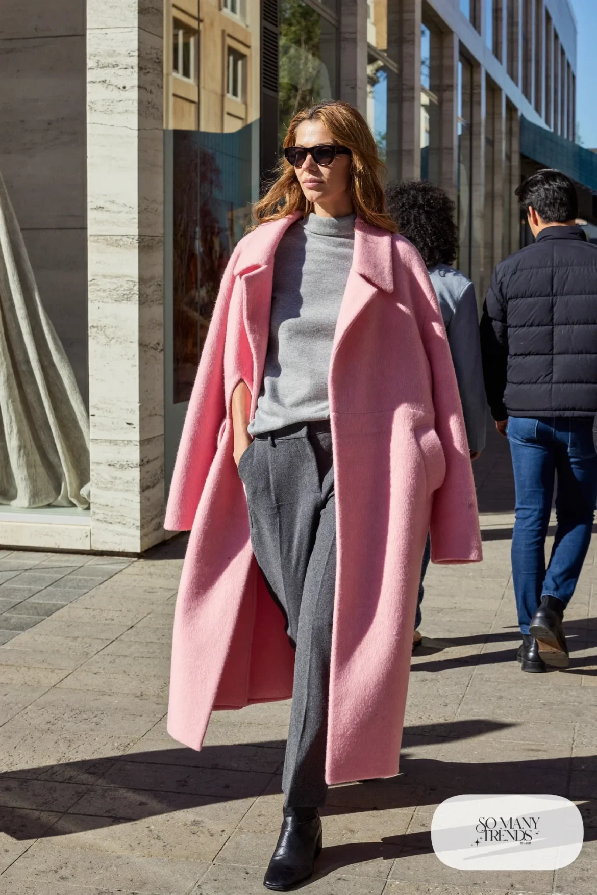 Woman in a pink wool cape coat, gray turtleneck, charcoal straight pants and black boots, outfit 29