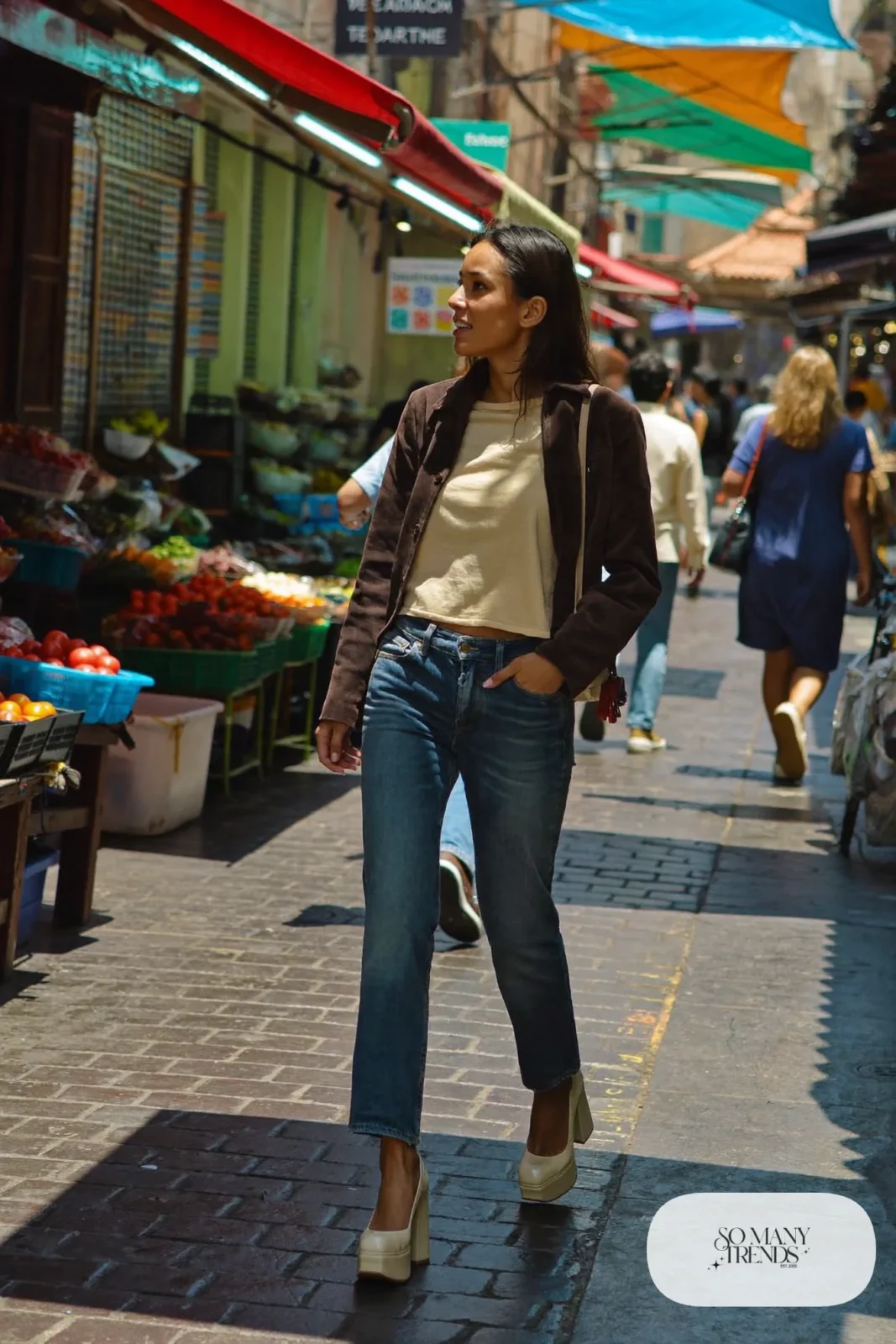 Woman in mid blue barrel jeans, chocolate suede jacket, cream tee and cream platform pumps, outfit 10