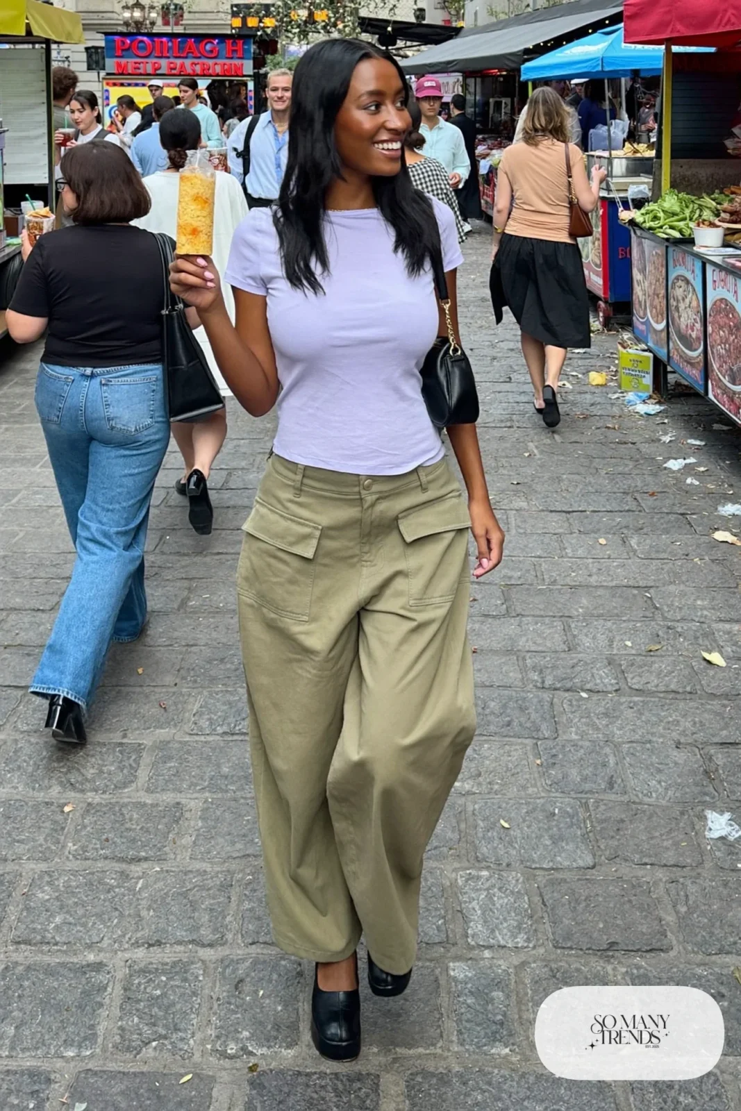 Woman in olive cargo pants, fitted lilac tee and black platform pumps, outfit 22