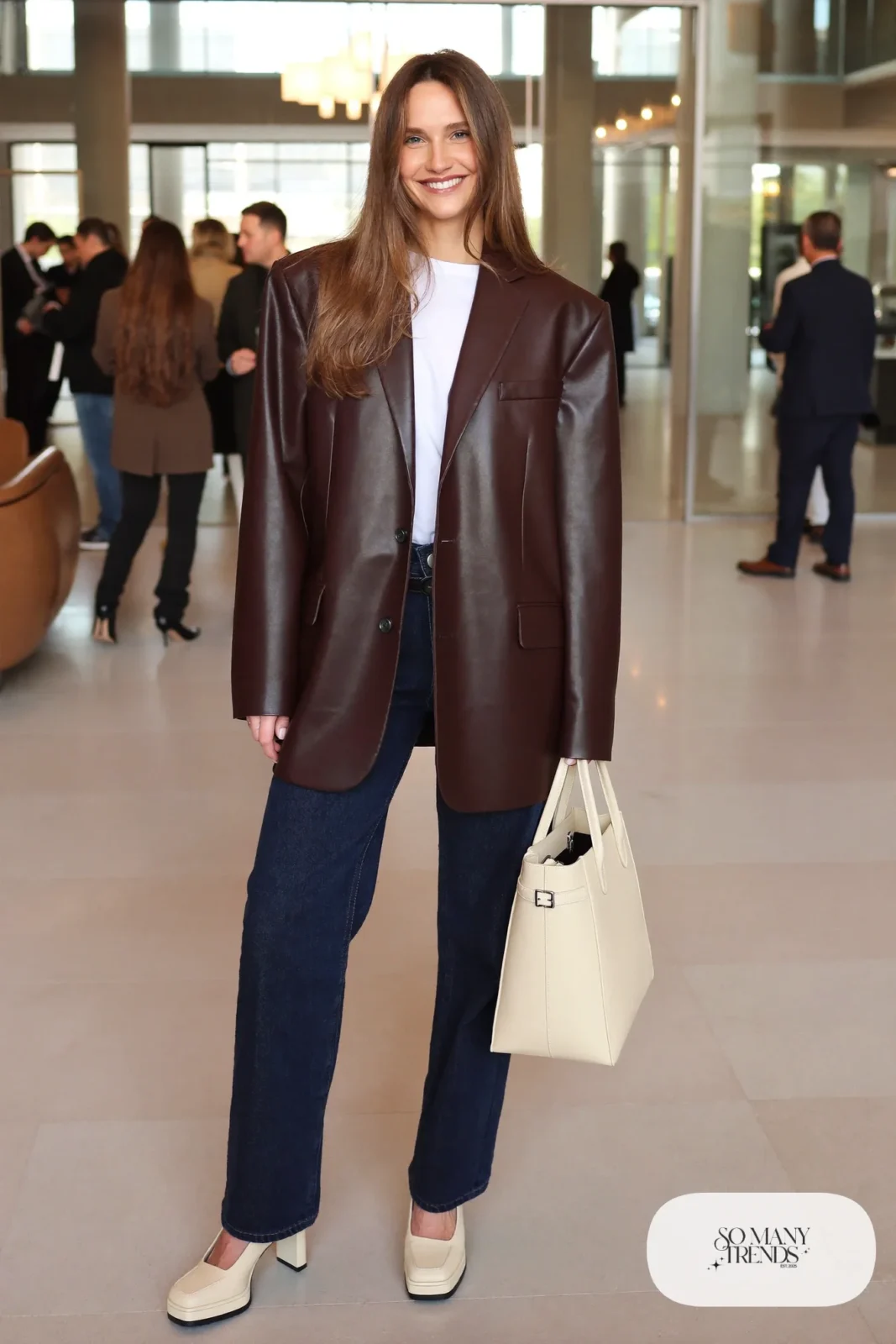 Woman in a chocolate oversize blazer, white tee, dark straight jeans and cream platform pumps, outfit 25