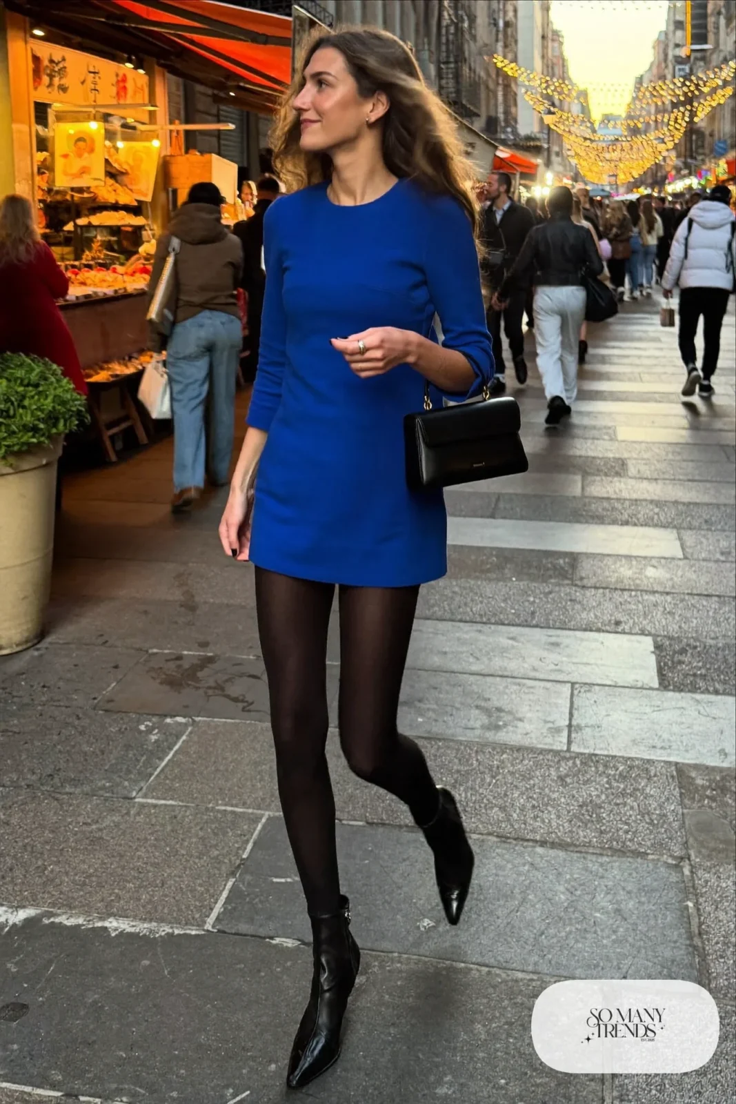 Cobalt blue long-sleeve mini dress with black opaque tights and black pointed ankle boots, outfit 13