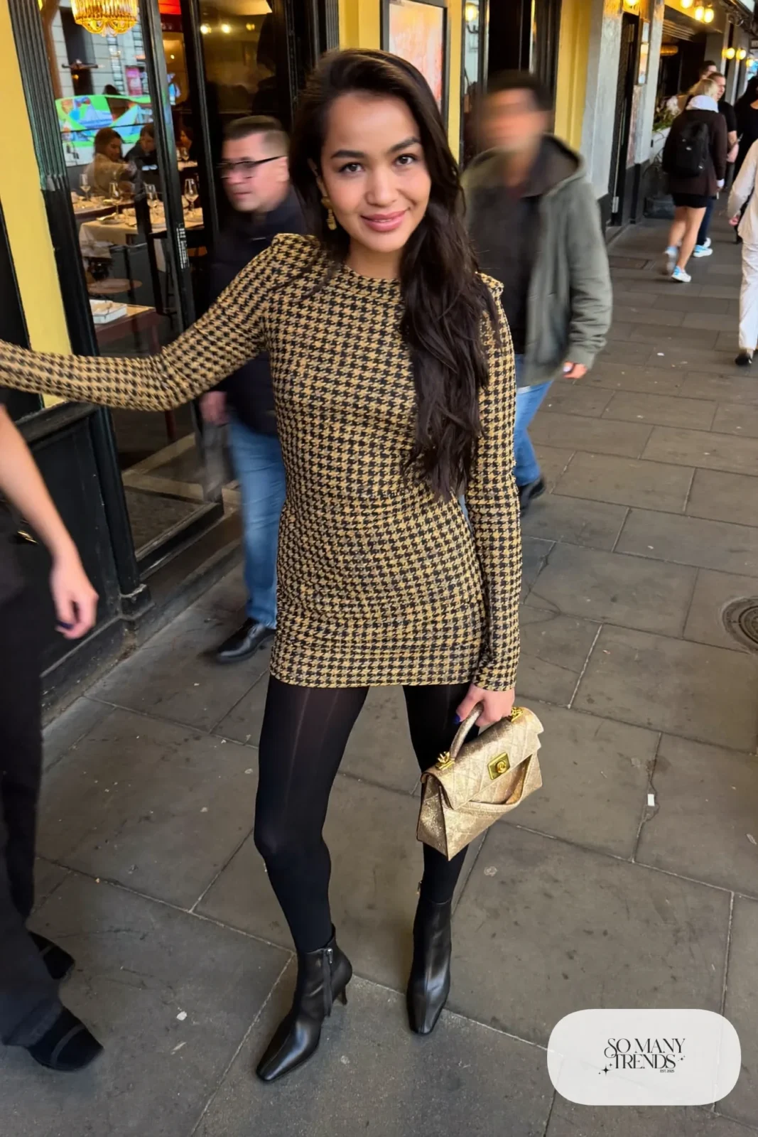 Black and gold jacquard long-sleeve mini dress with black opaque tights and black heeled ankle boots, outfit 20