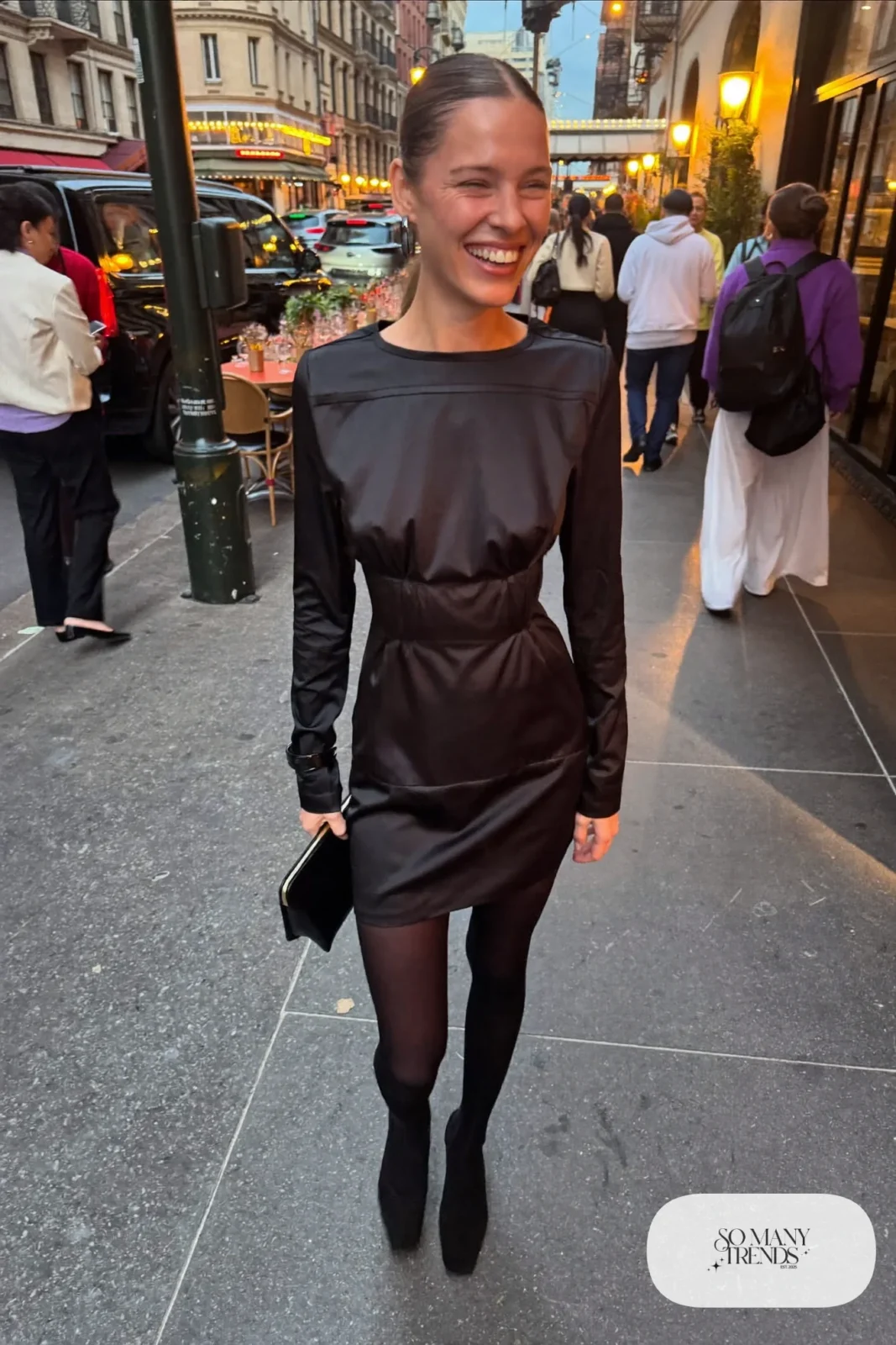 Black crepe long-sleeve mini dress with satin trim, sheer black tights and black block-heel pumps, outfit 27