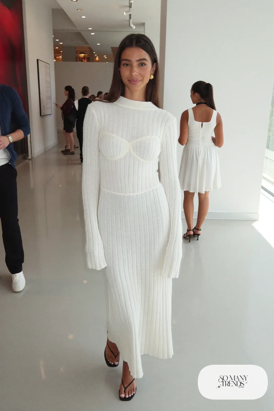 Woman in a white ribbed knit corset maxi dress with long sleeves and minimal sandals, outfit 8