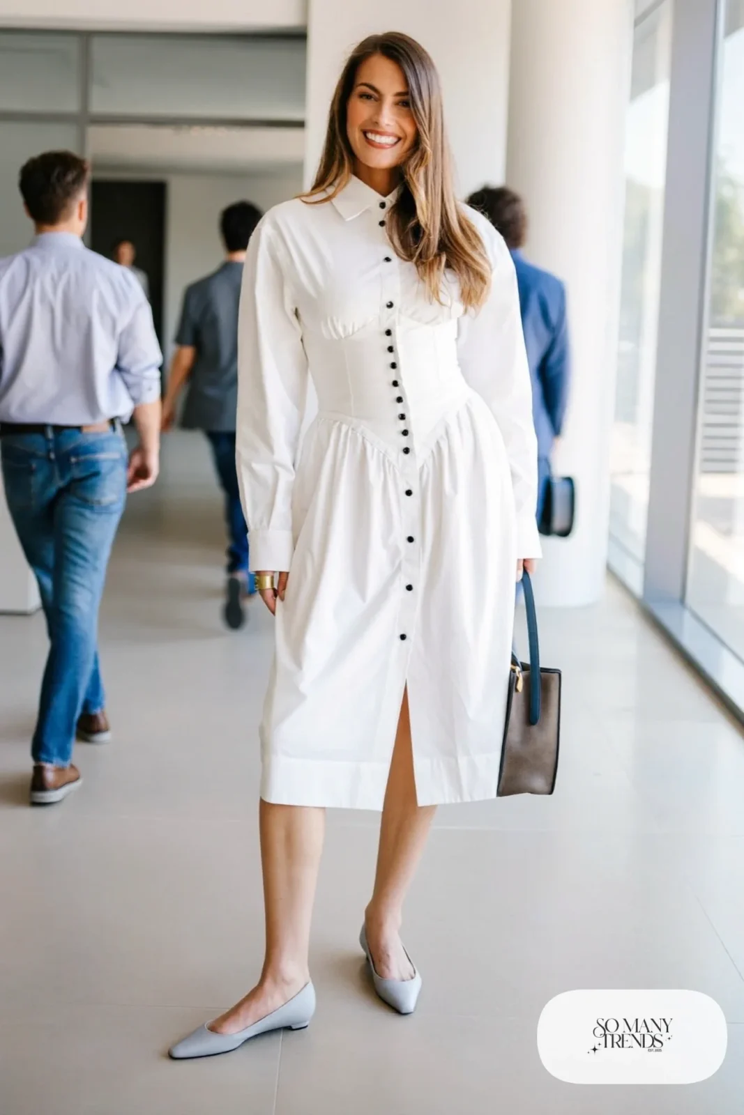 Woman in a white tailored corset shirtdress with long sleeves and pointed flats, outfit 10
