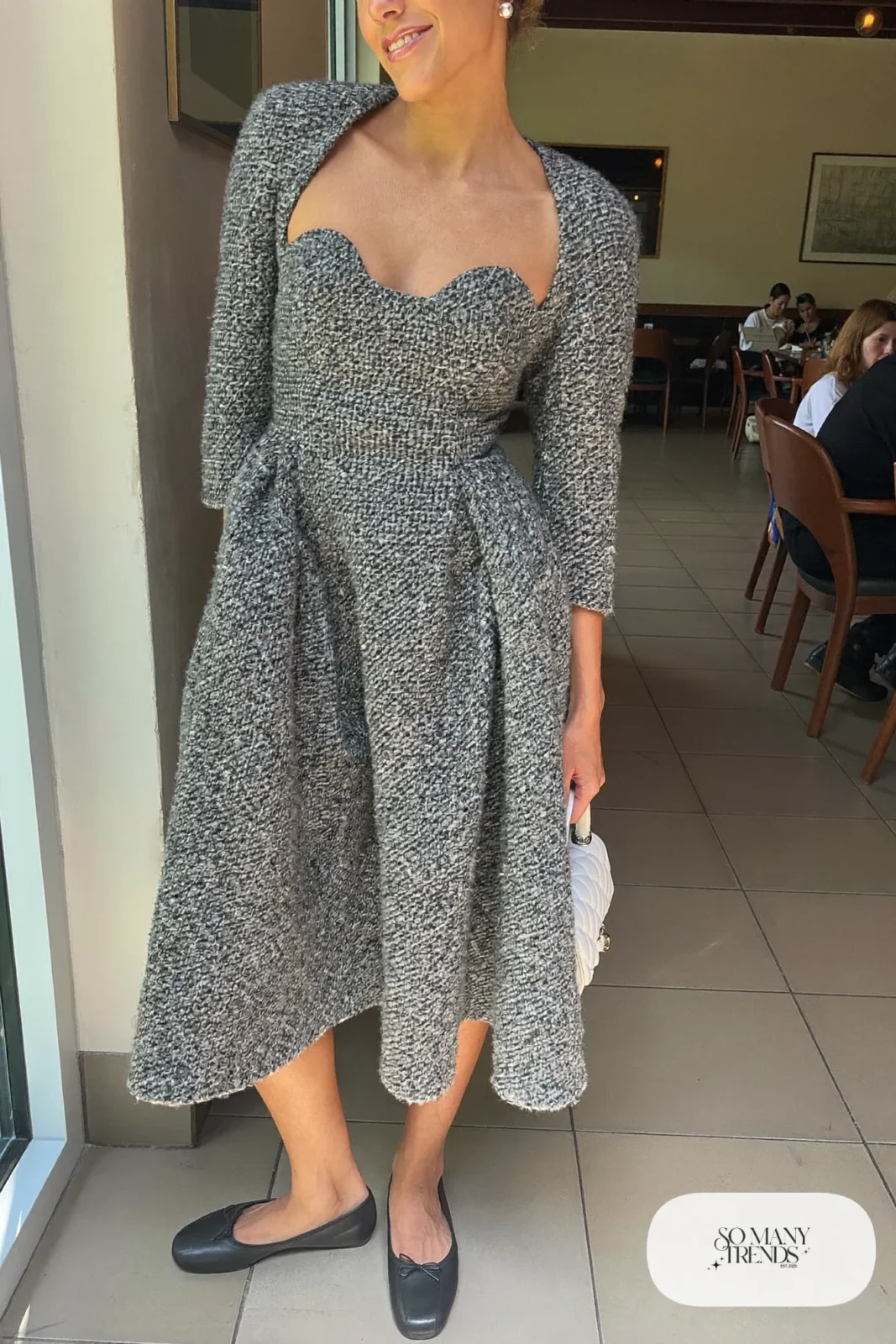Woman in a gray tweed corset dress with three-quarter sleeves and ballet flats, outfit 15