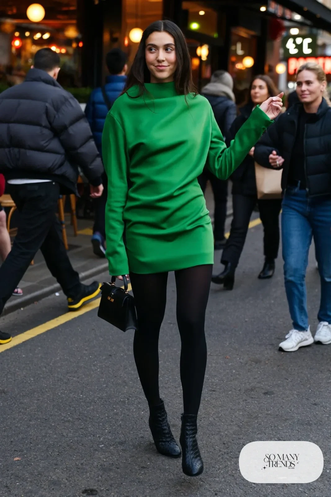 Emerald green long-sleeve mini dress with black opaque tights and black heeled ankle boots, outfit 11