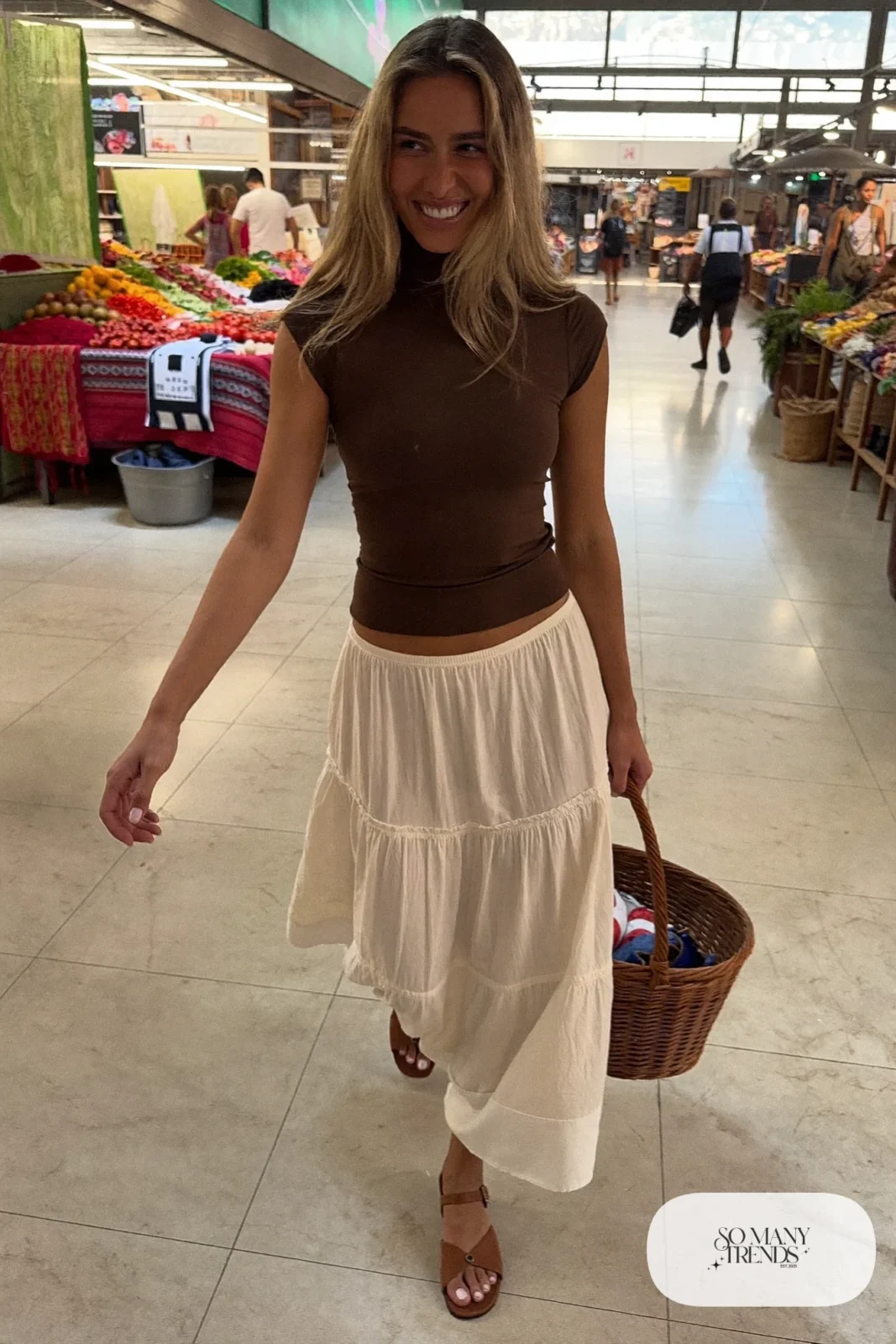 Cream tiered maxi skirt with fitted chocolate brown tee tucked in and tan sandals, outfit 4