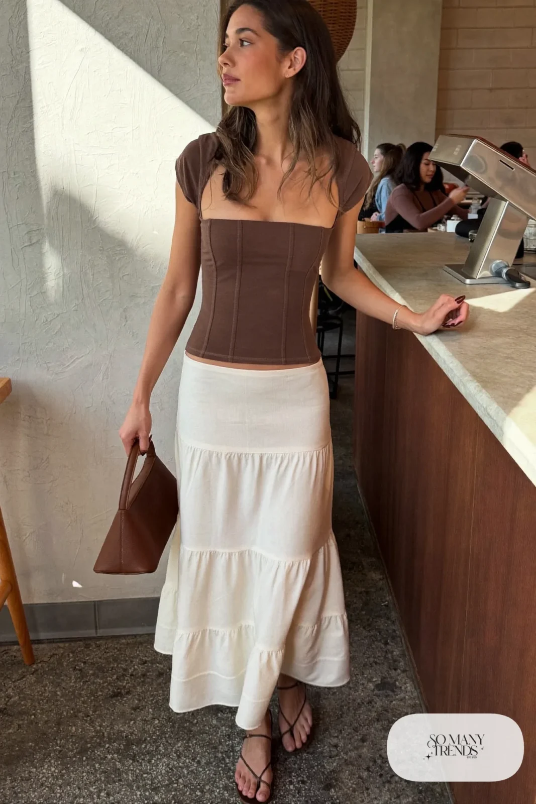 Cream tiered midi skirt with fitted brown corset-seam top and brown strappy flats, outfit 11