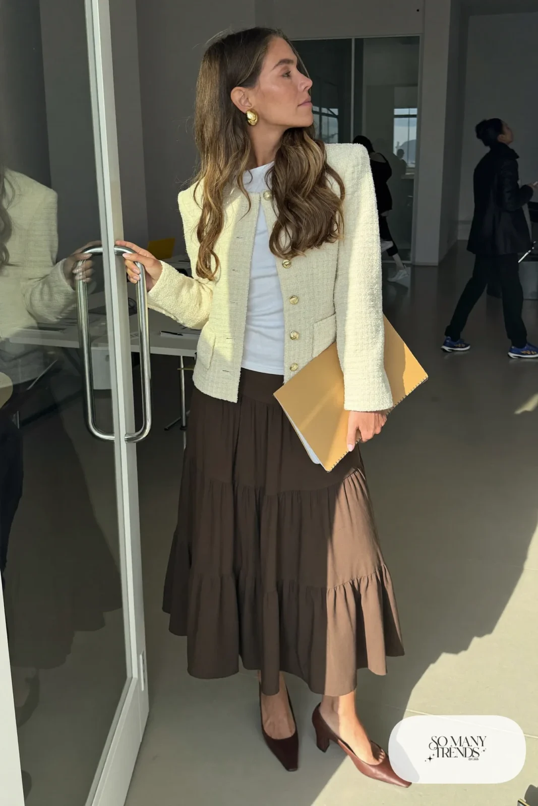 Chocolate brown tiered midi skirt with cream short tweed jacket over fitted white top and brown pumps, outfit 15