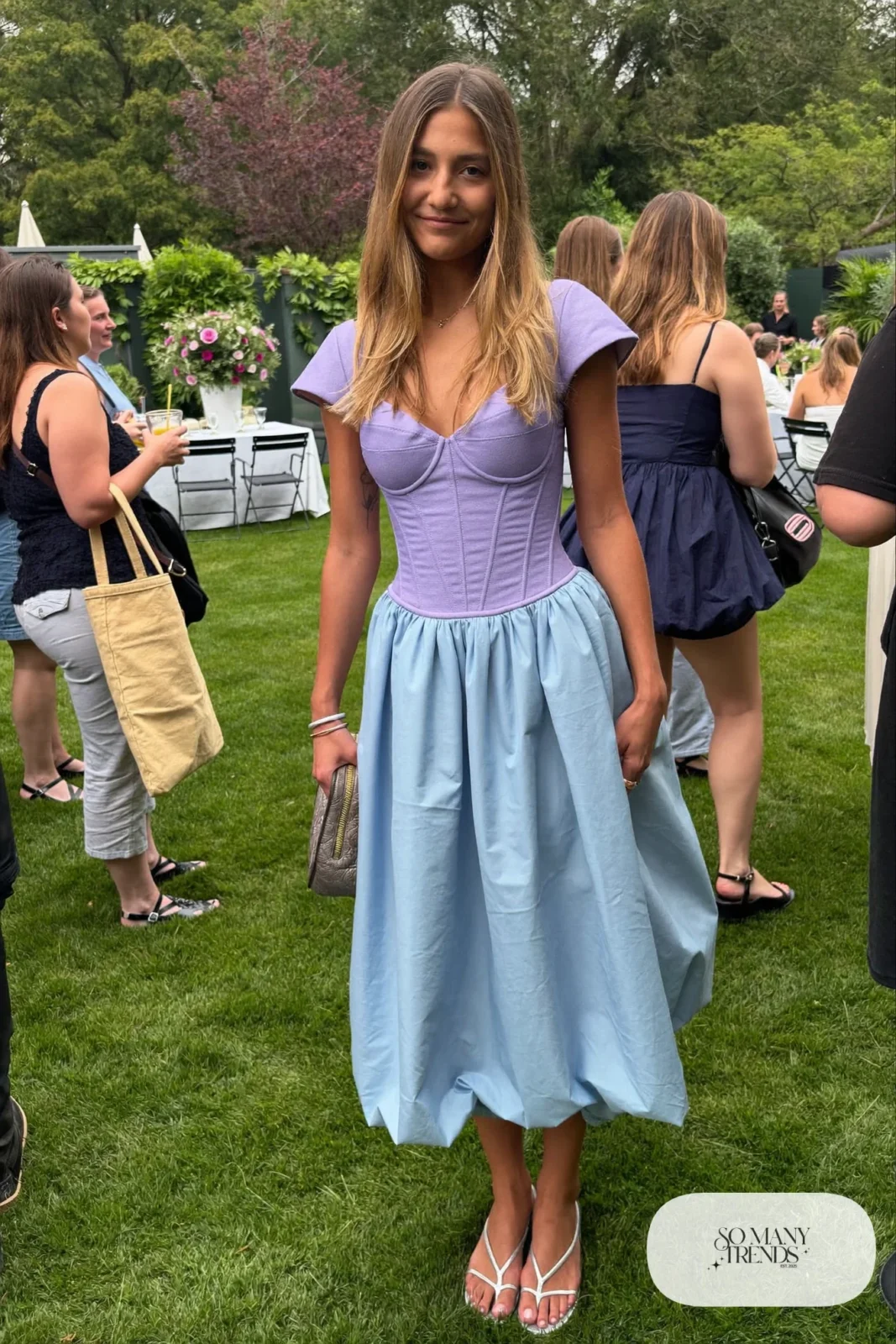 Woman in a lilac and powder blue color-block corset midi dress with sandals, outfit 16