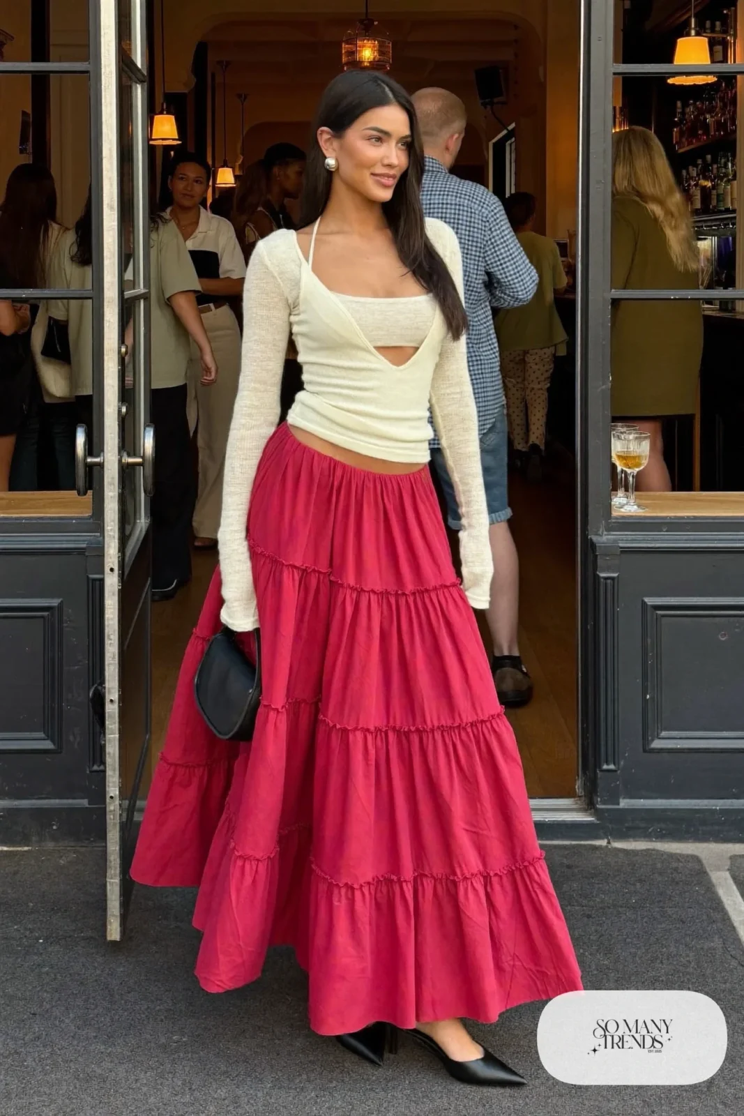 Wine red tiered maxi skirt with fitted cream deep V knit top over camisole and black pointed heels, outfit 27
