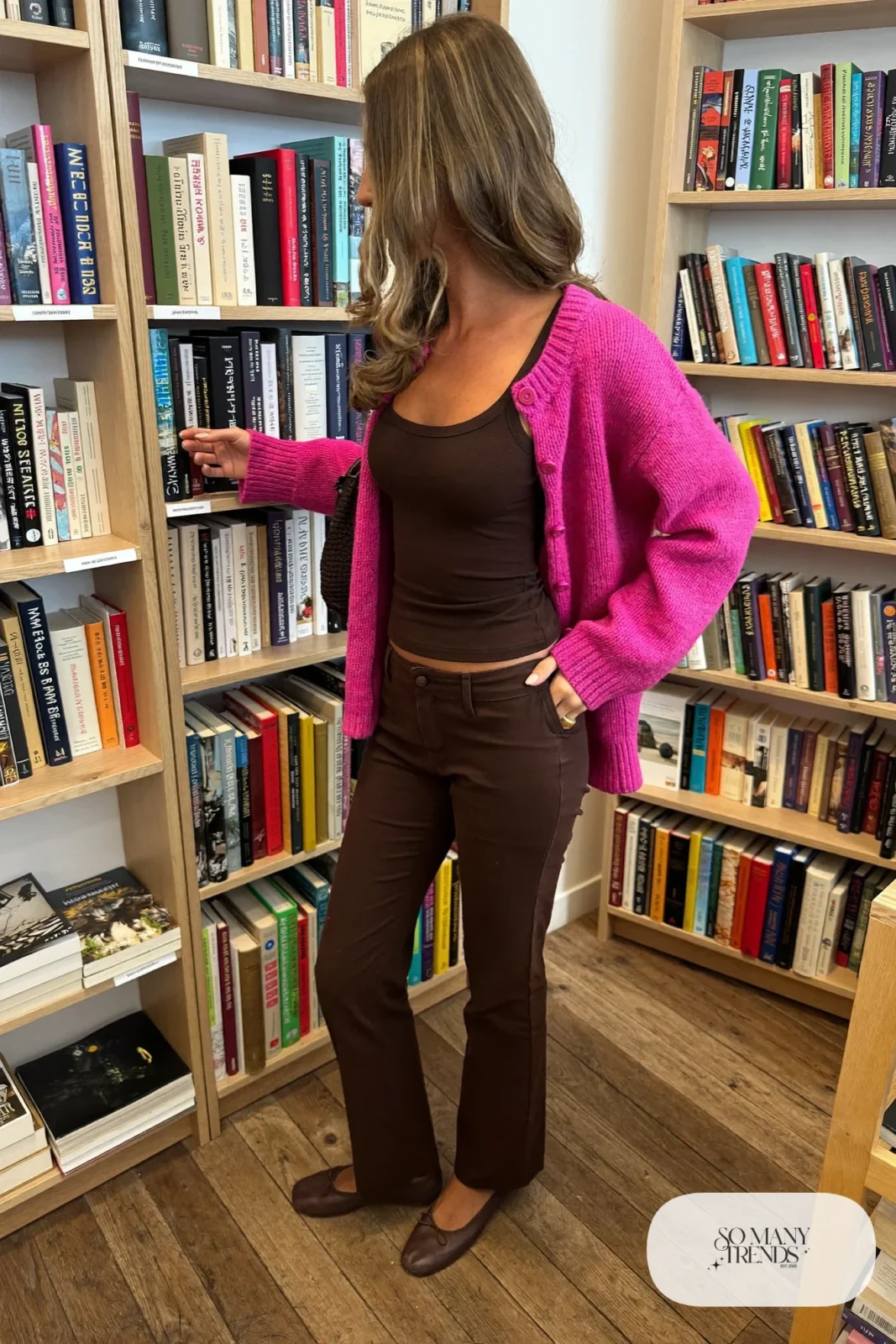 Hot pink boxy knit cardigan over a fitted chocolate brown tank, brown straight-leg pants and brown ballet flats, outfit 2