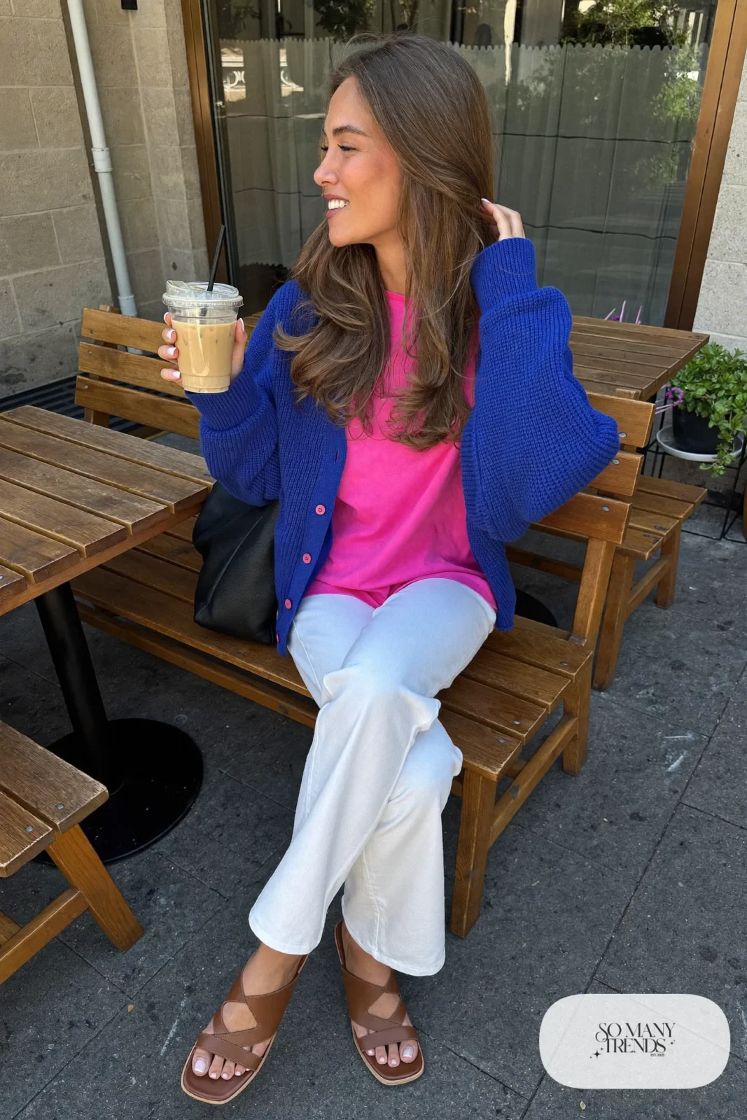 Cobalt blue knit cardigan over a hot pink tee with white straight-leg jeans and tan sandals, outfit 12