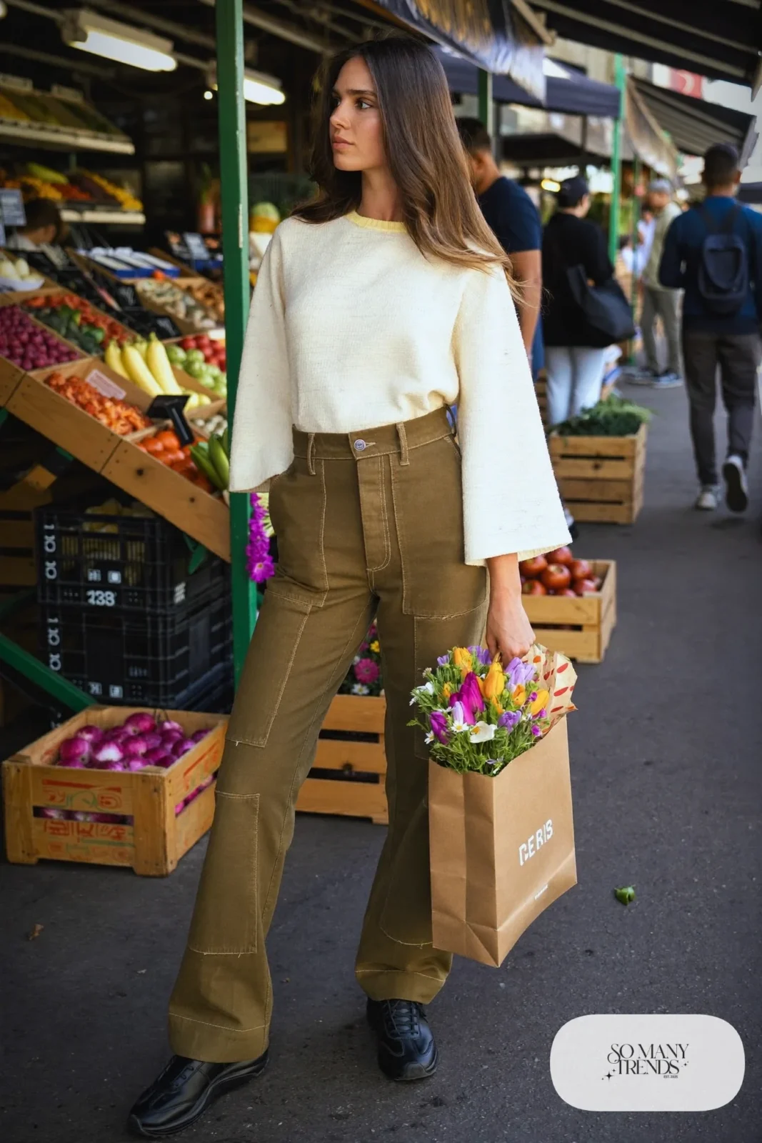 Look 12: cream bell sleeve top, olive straight-leg cargo pants and black leather sneakers