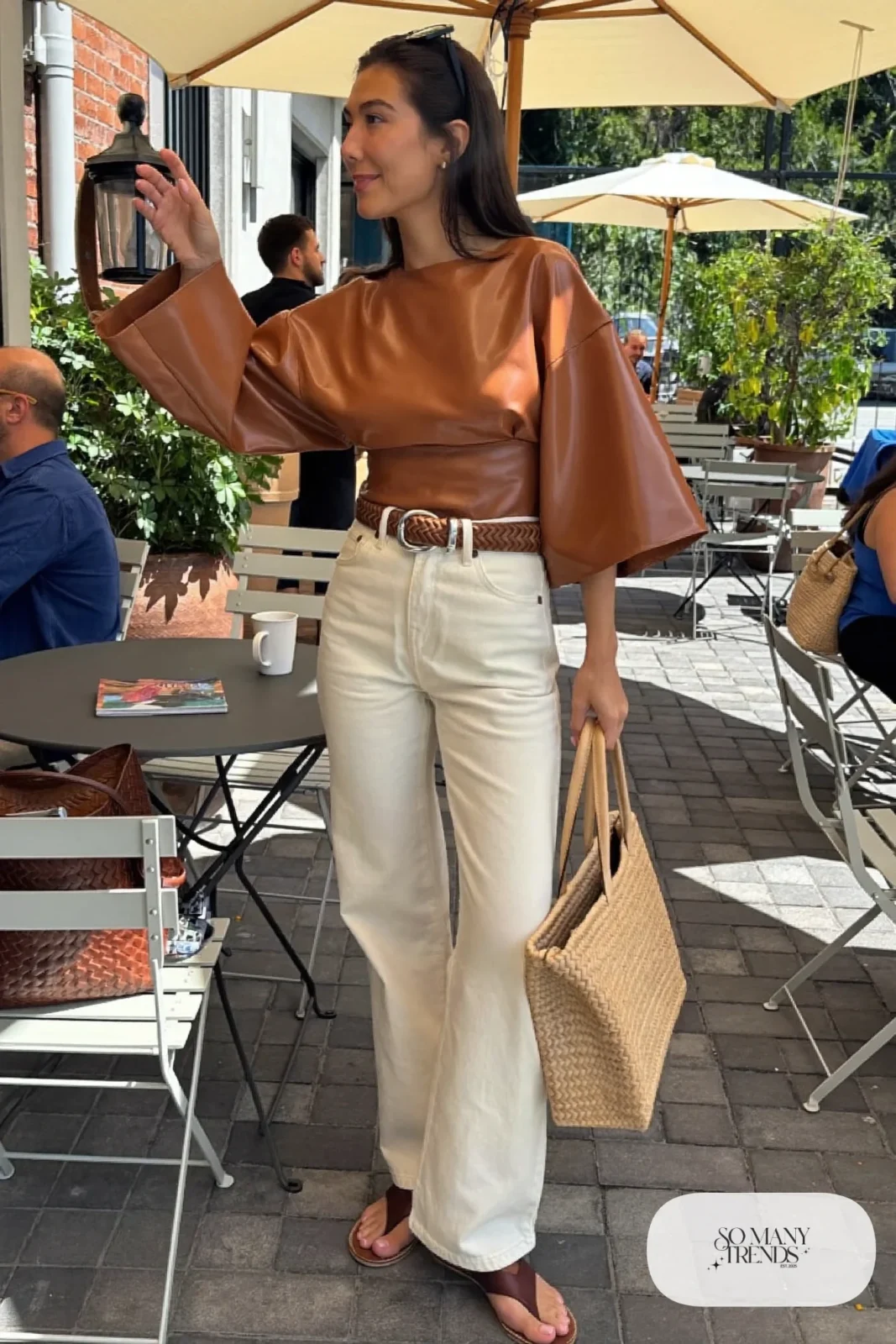 Look 20: terracotta bell sleeve top, cream wide-leg jeans, woven tan belt and brown leather sandals