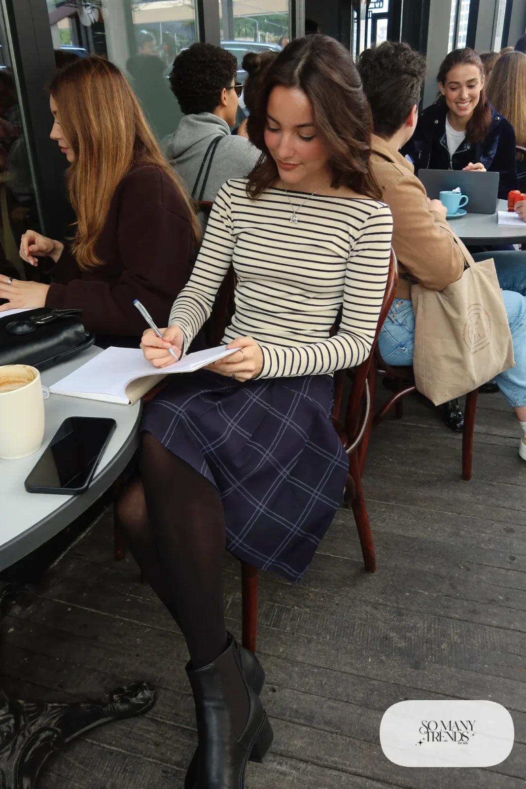 Navy plaid midi skirt with cream and navy striped long sleeve top, black tights and black boots, outfit 15