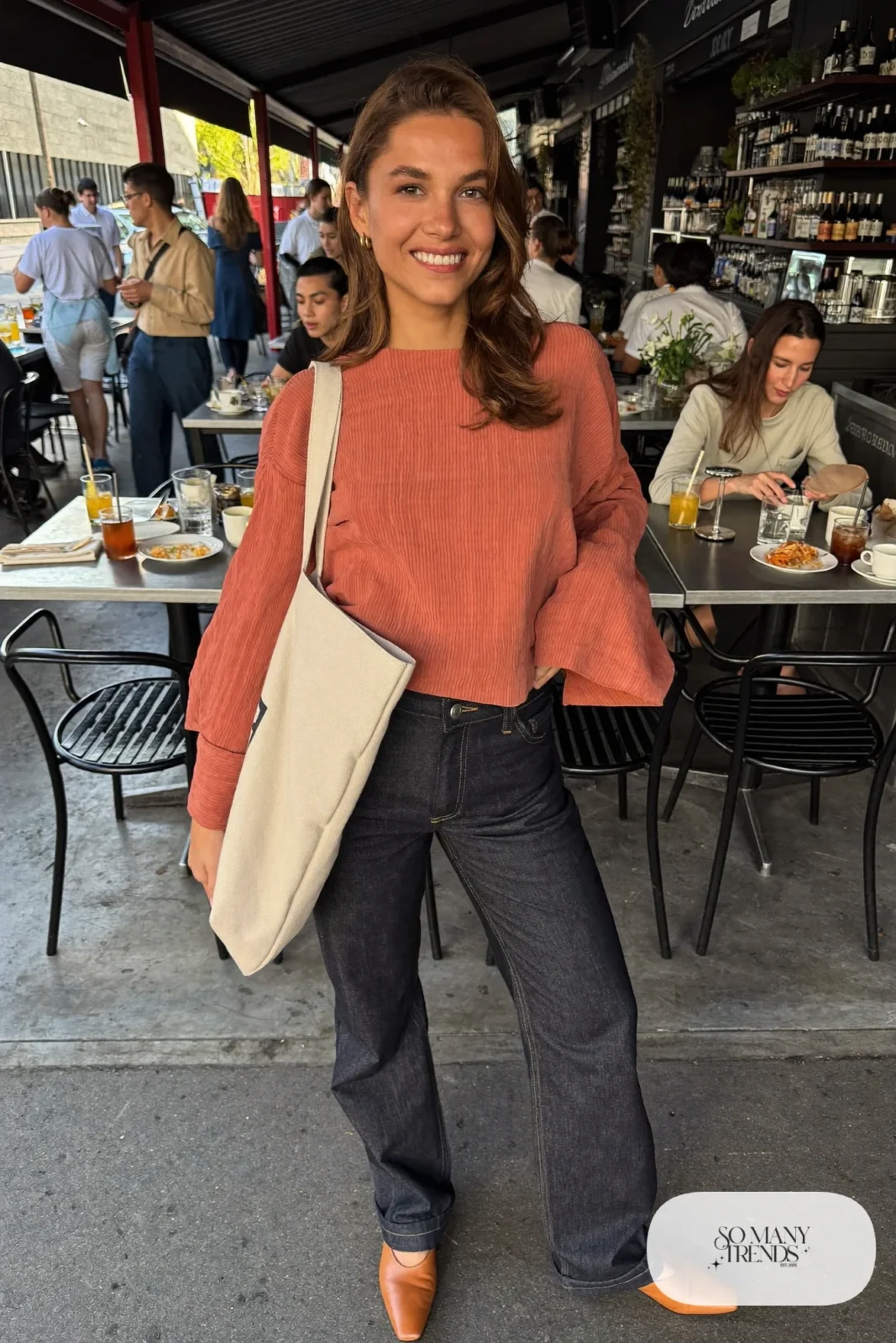 Look 1: terracotta bell sleeve top, dark indigo straight-leg jeans and tan leather mules