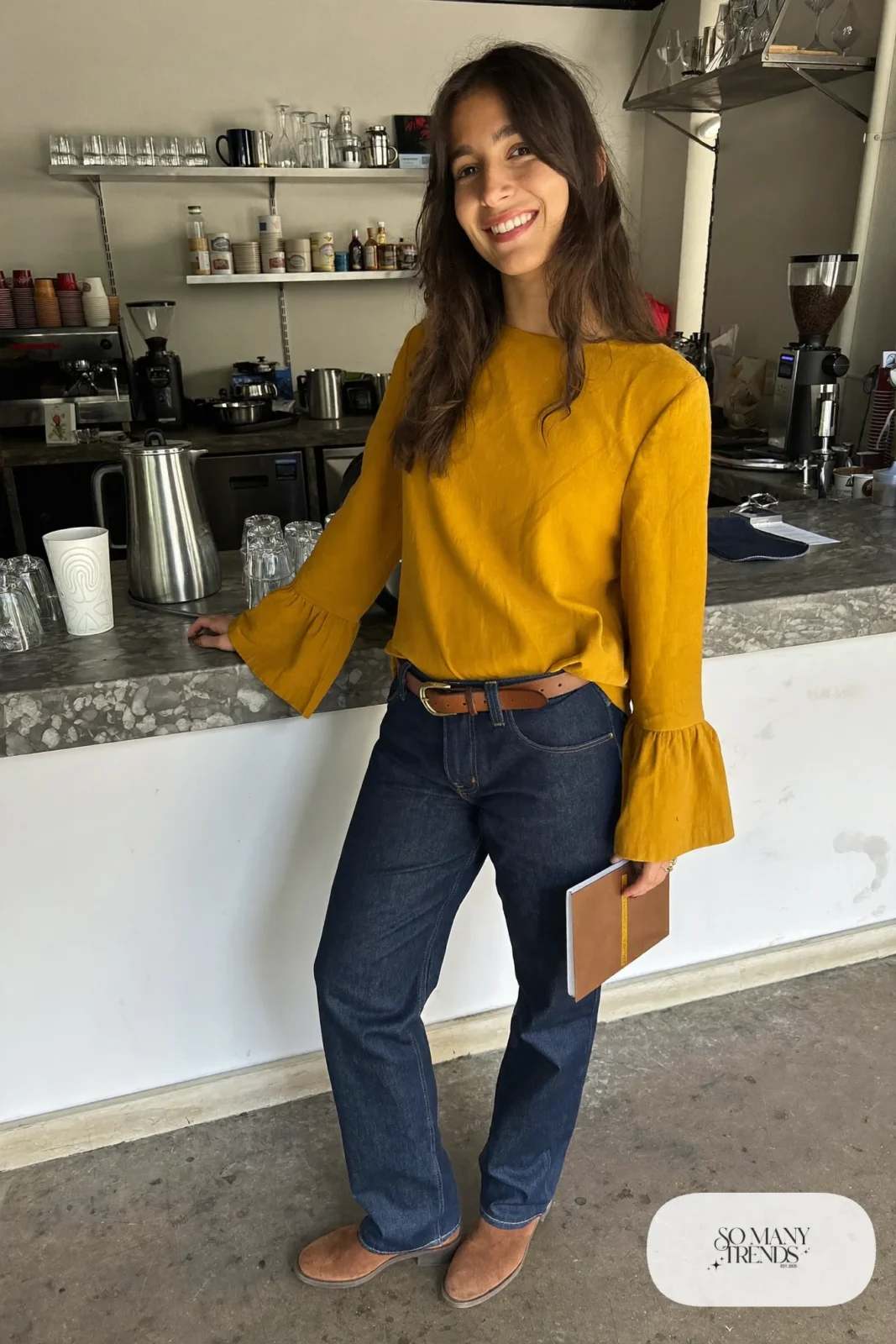 Look 10: mustard bell sleeve top, dark indigo jeans, cognac leather belt and brown suede ankle boots