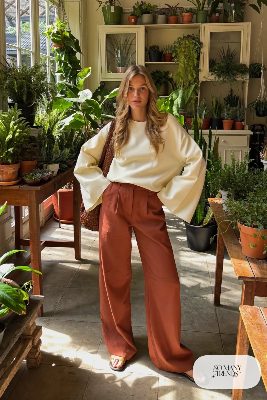 Look 26: cream bell sleeve top, terracotta wide-leg pants and tan leather sandals
