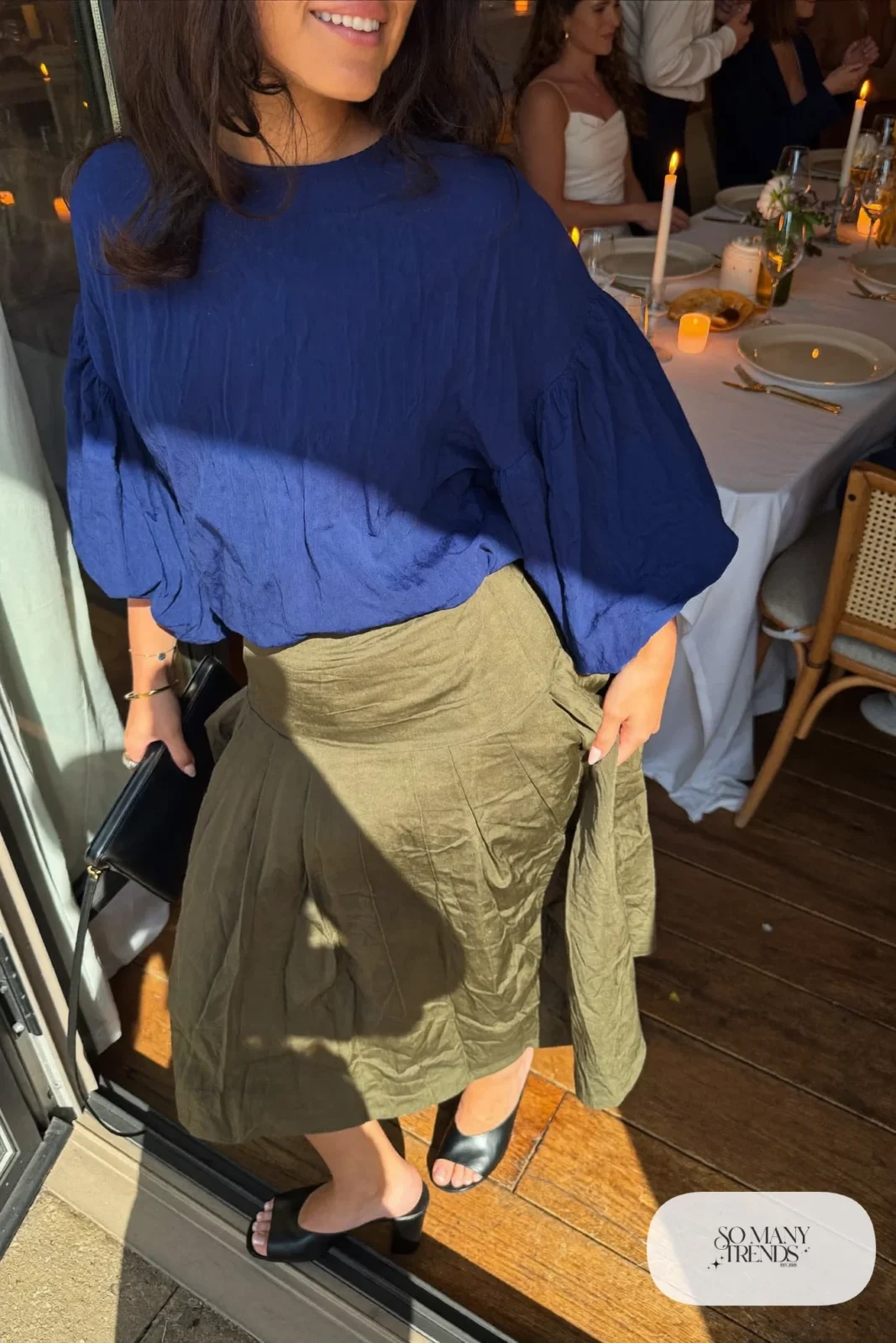 Look 27: indigo bell sleeve top, olive pleated midi skirt, thin brown belt and black block-heel mules
