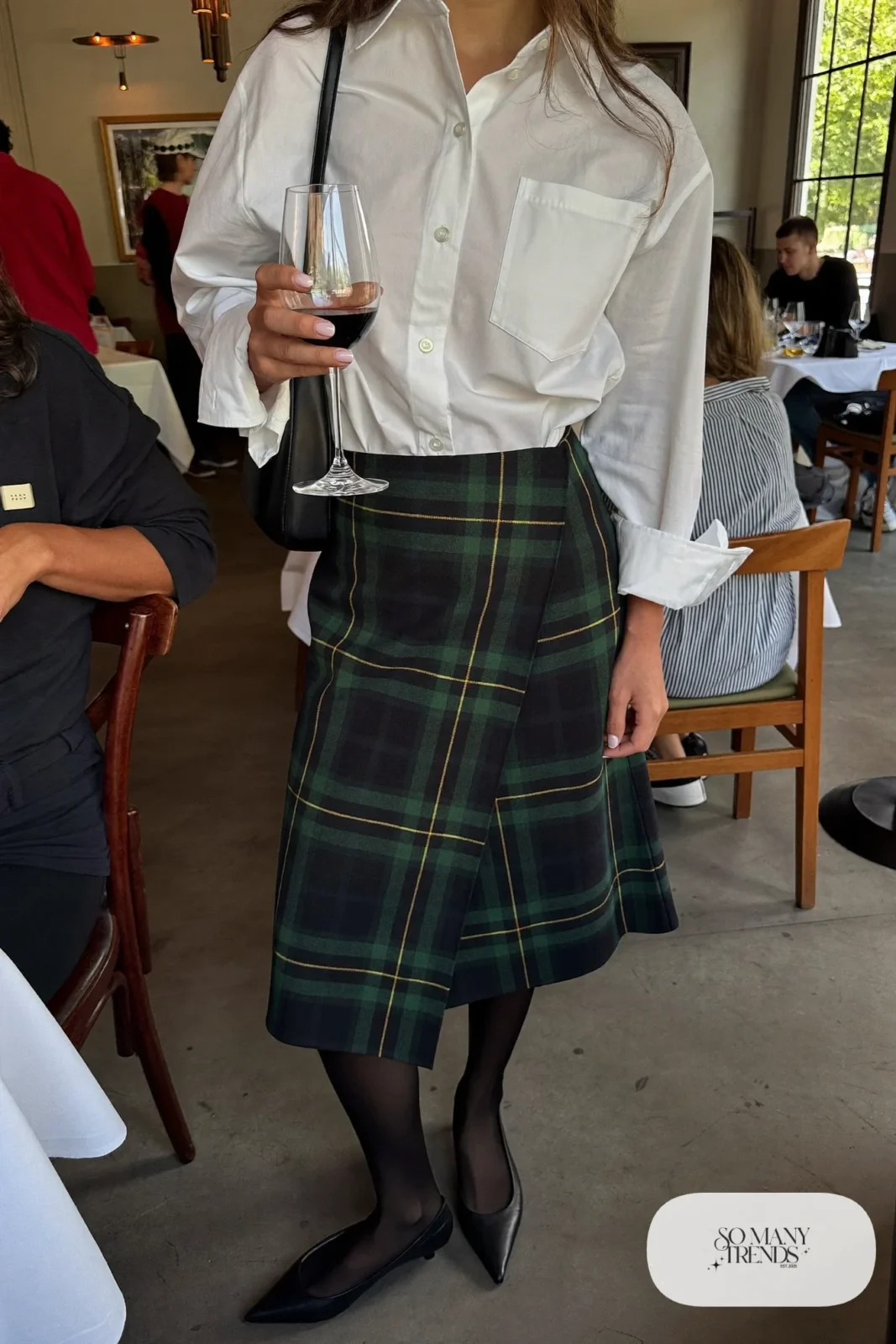 Black and green plaid wrap midi skirt with oversize white poplin shirt and black pointed flats, outfit 6