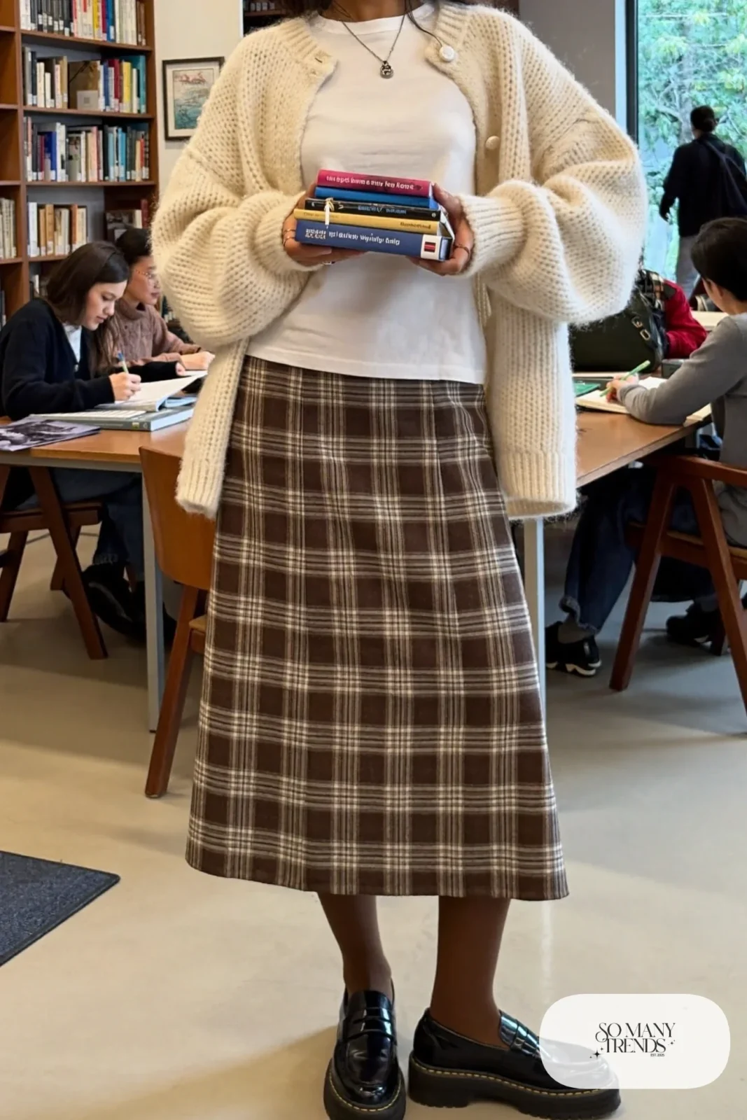 Brown plaid mini-midi skirt with oversize cream cardigan, white tee, brown tights and chunky black loafers, outfit 13