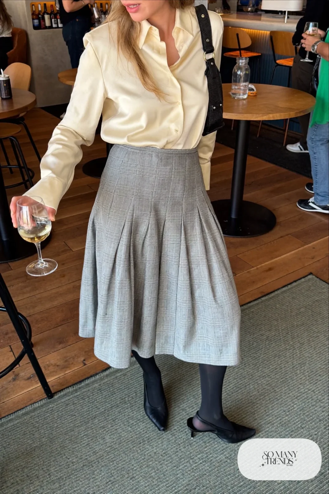 Gray plaid pleated midi skirt with cream satin shirt, slim belt, sheer tights and black slingbacks, outfit 24