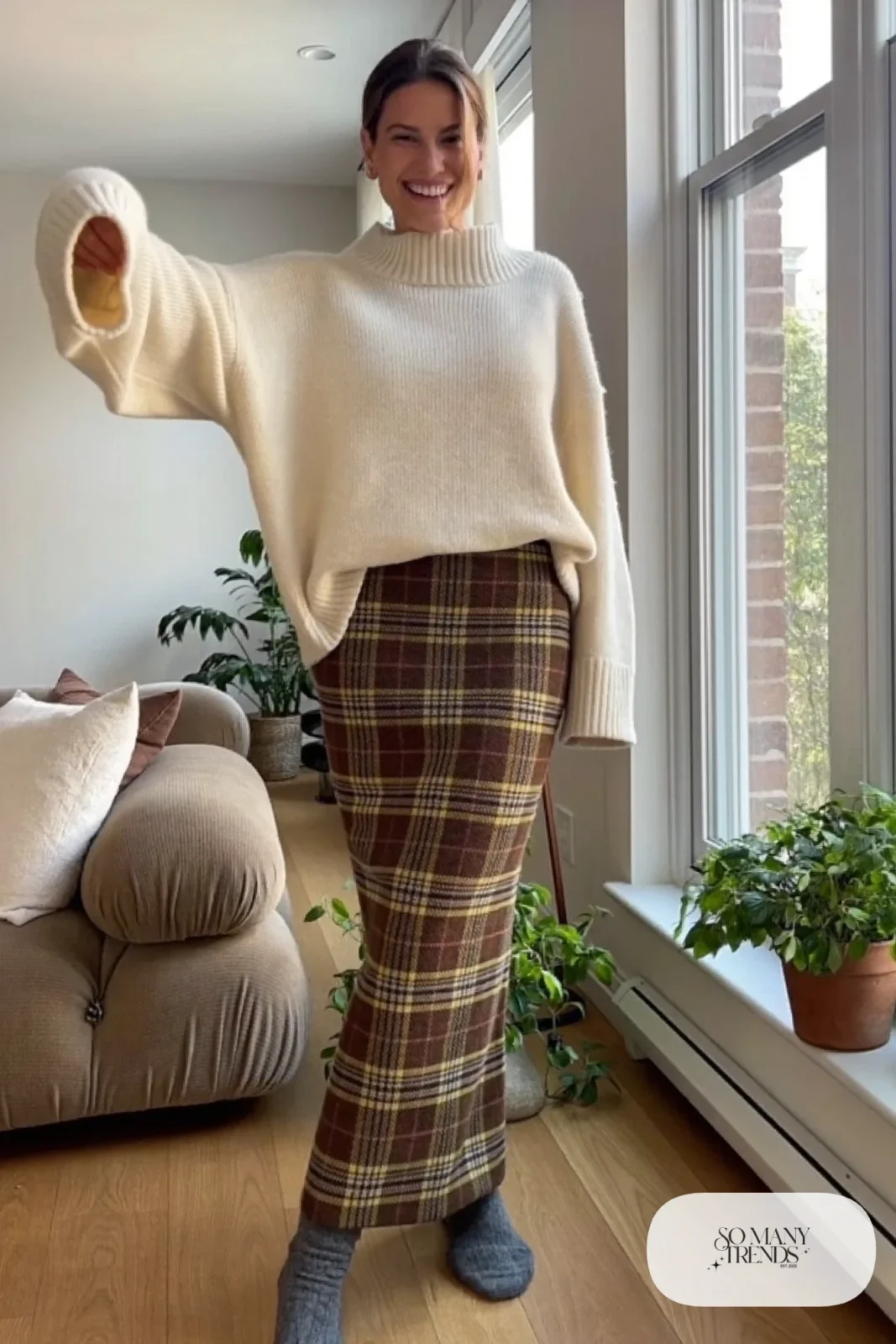 Brown plaid midi skirt with oversize cream chunky sweater, thick gray socks and no shoes, outfit 25