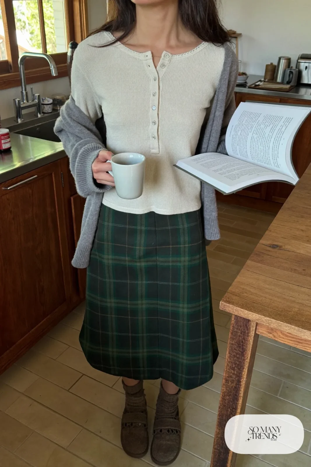 Forest green plaid midi skirt with oatmeal waffle knit henley and gray cardigan, brown socks and slippers, outfit 26