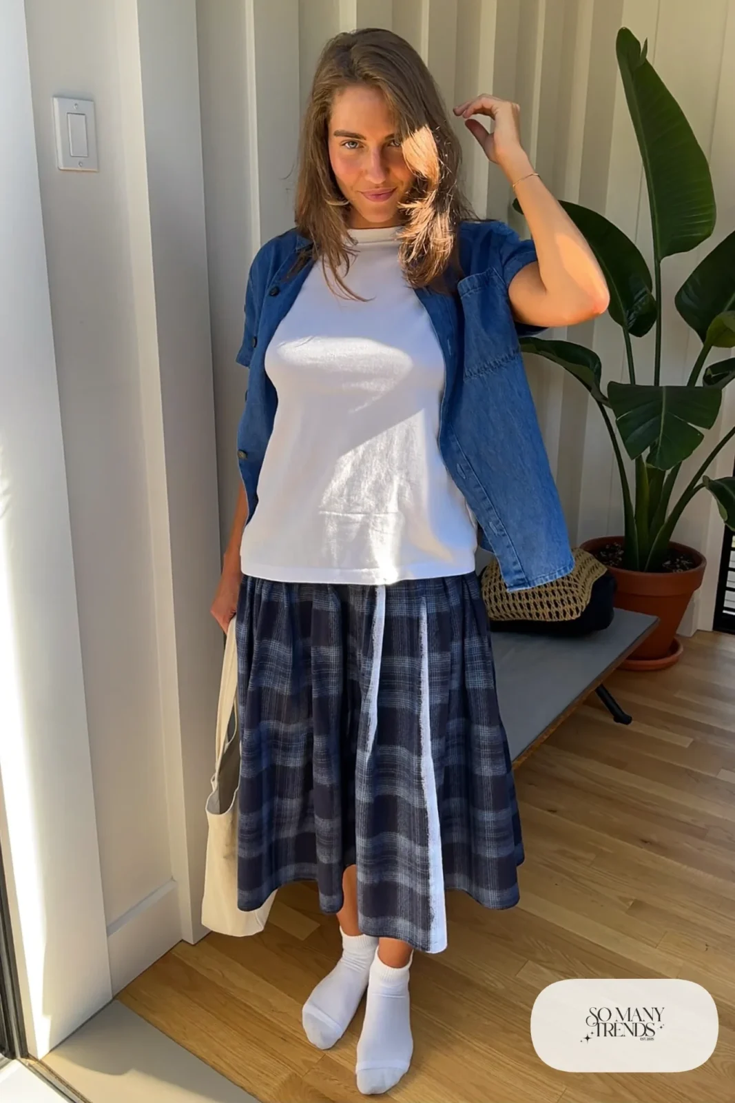 Navy plaid midi skirt with open denim blue flannel shirt over white tee and white socks, outfit 27
