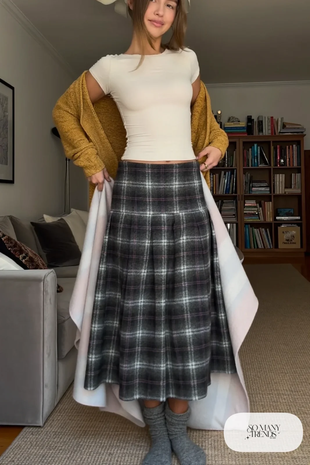 Charcoal plaid midi skirt with chunky mustard knit cardigan, cream tee and gray socks, outfit 28