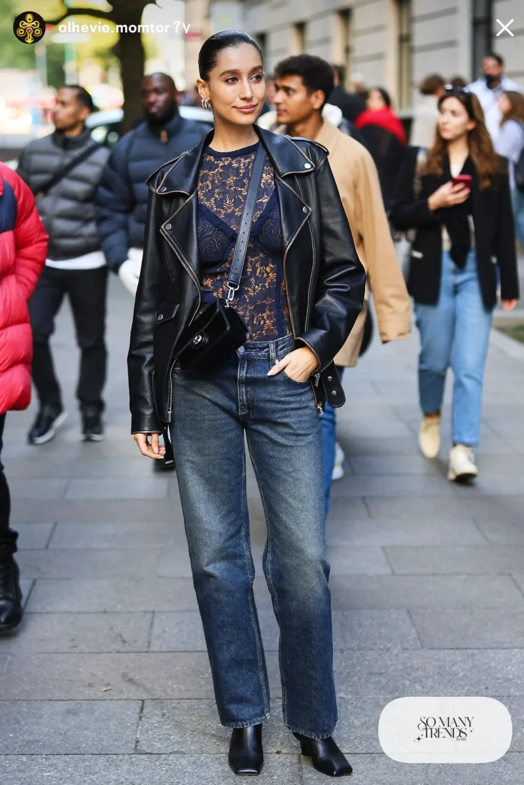 Navy long-sleeve lace top under a black leather moto jacket with straight jeans and black ankle boots, look 21