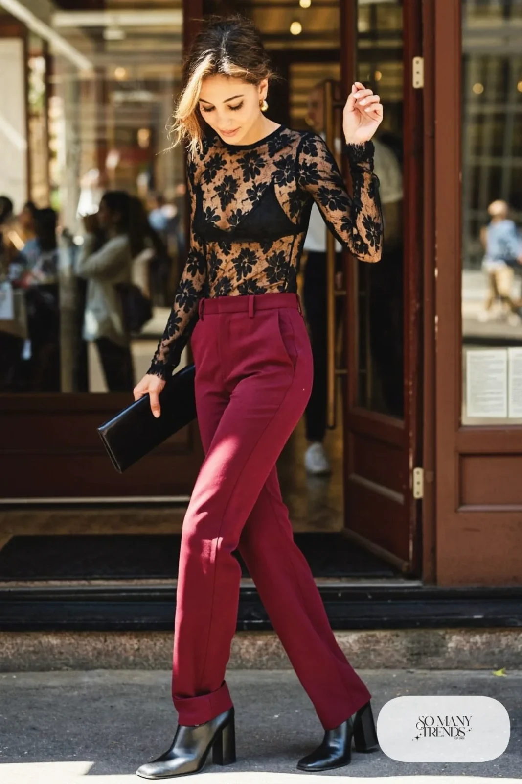 Black long-sleeve lace top with burgundy high-waisted crepe straight pants, block heel boots and gold hoop earrings, look 24