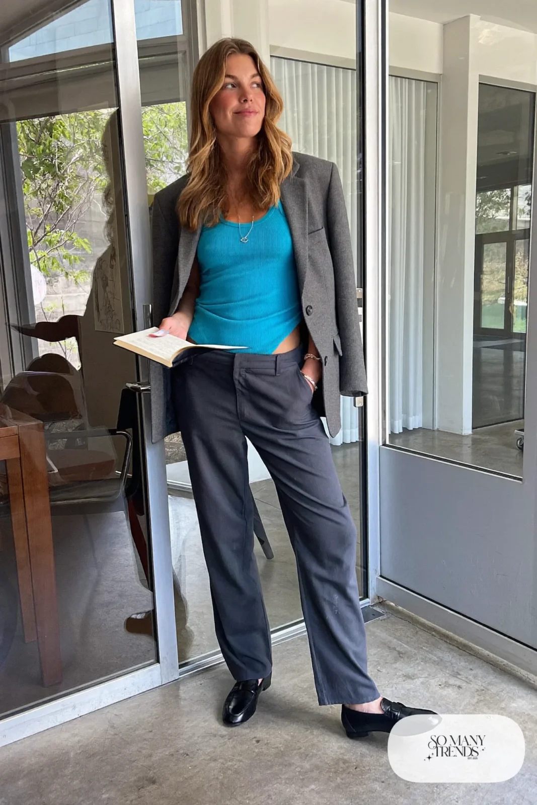 Woman in a turquoise knit tank, gray blazer, dark gray straight pants and black loafers, outfit 2