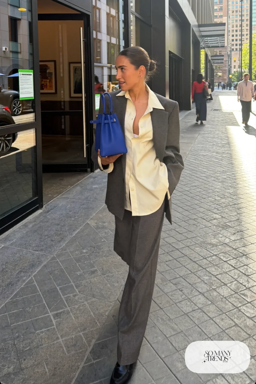 Gray longline blazer, cream shirt, gray wide-leg pants, black loafers and cobalt blue tote bag, outfit 14