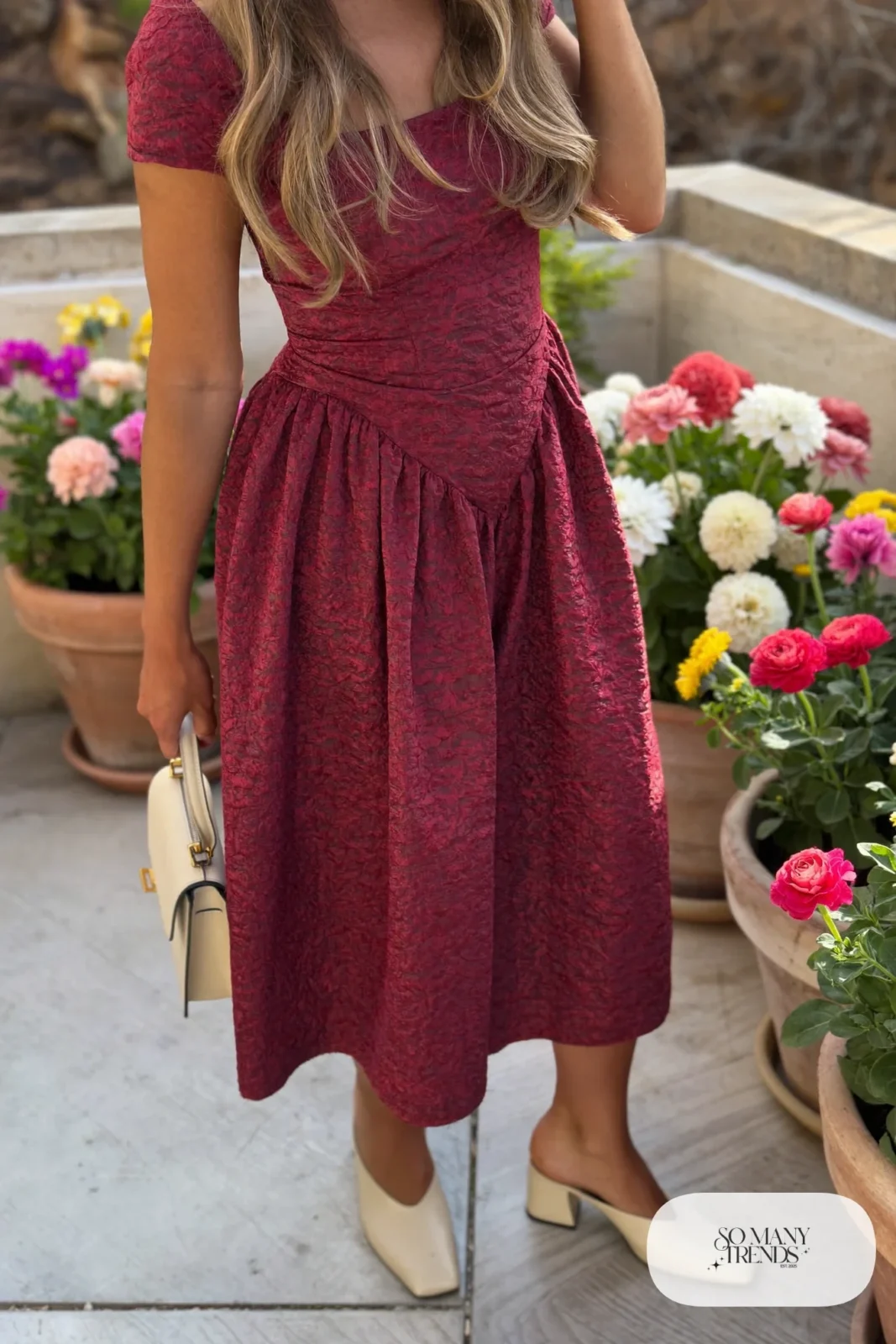 Woman in a wine red jacquard midi dress with gathered skirt and cream block-heel mules, garden party outfit 5