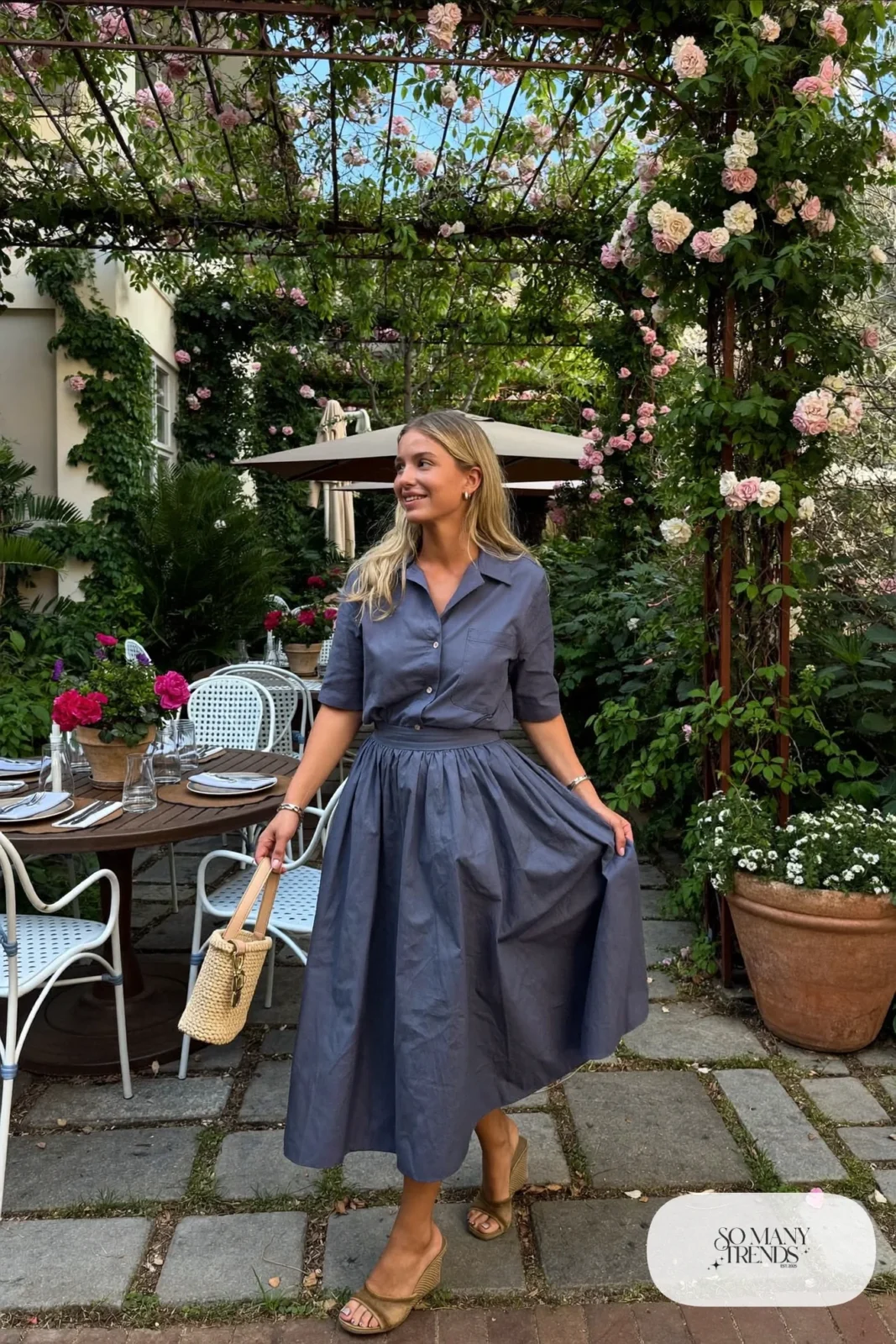 Woman in a slate blue cotton poplin matching shirt and midi skirt set with tan wedge sandals, garden party outfit 14