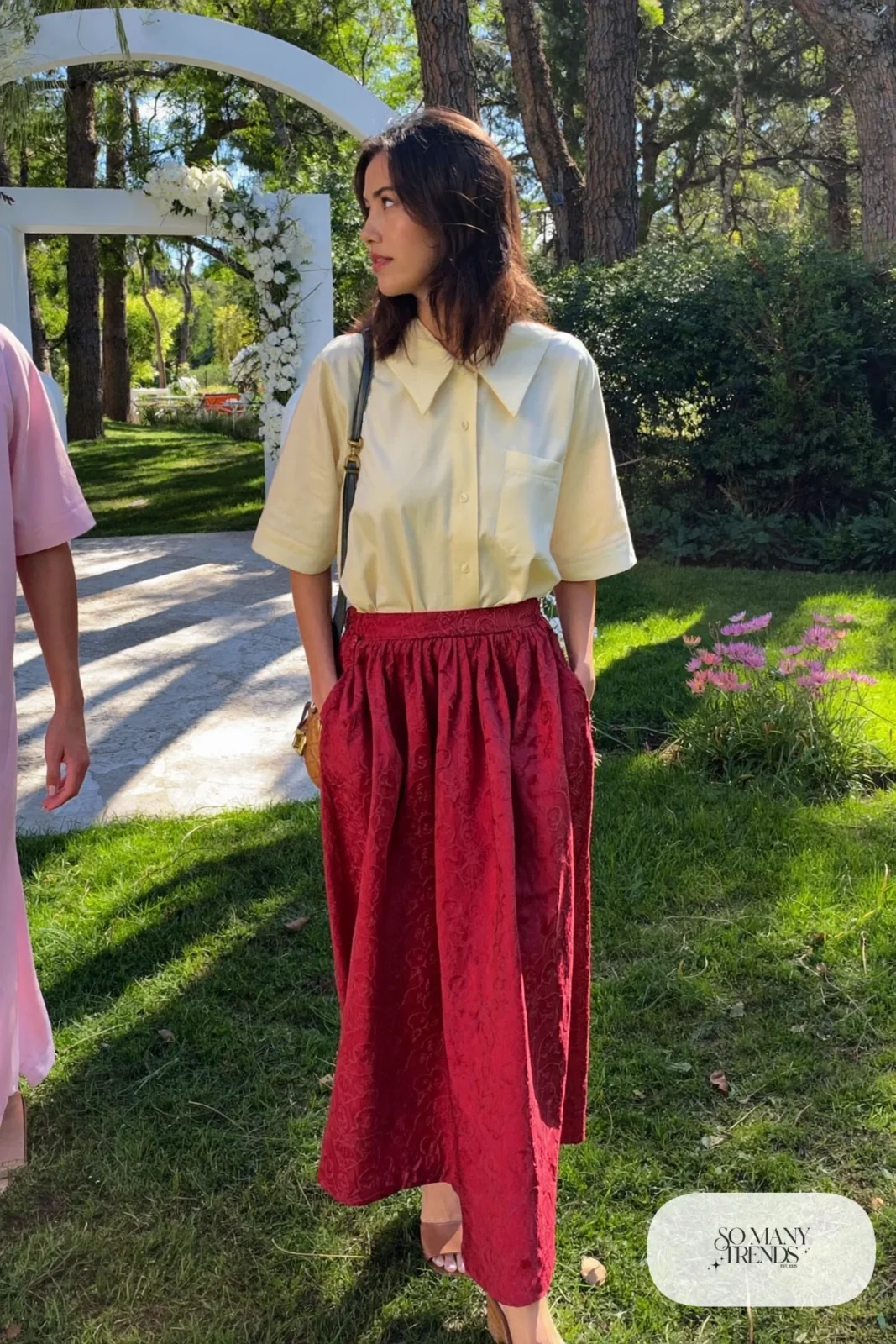 Woman in a wine jacquard midi skirt with a cream cotton blouse and block-heel sandals, garden party outfit 16